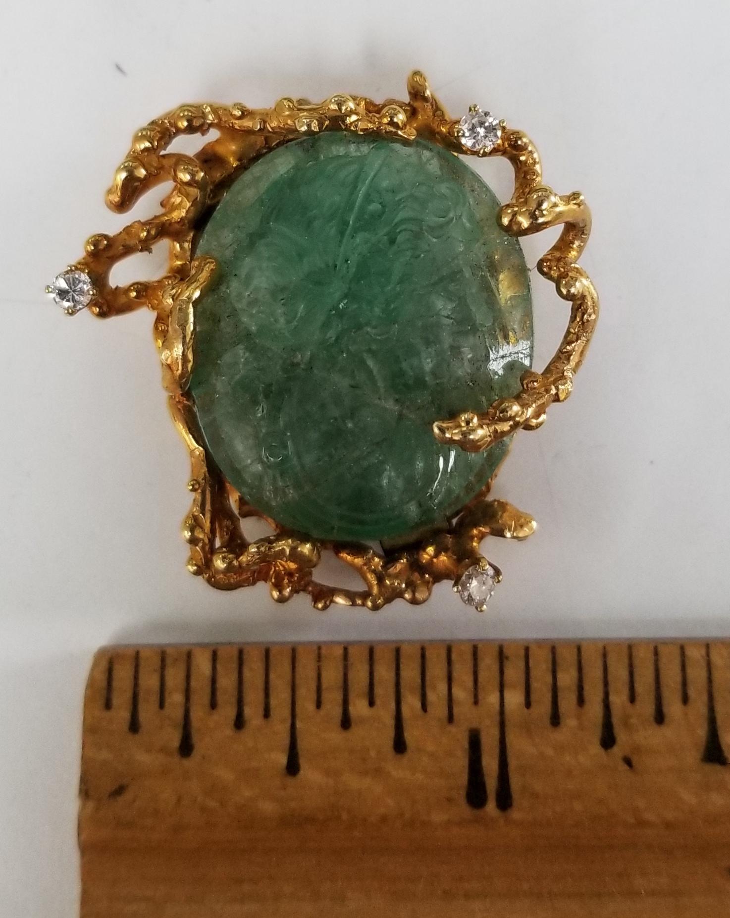 Round Cut 14 Karat Yellow Gold Pin/Pendant with a Hand Carved Emerald with Diamonds