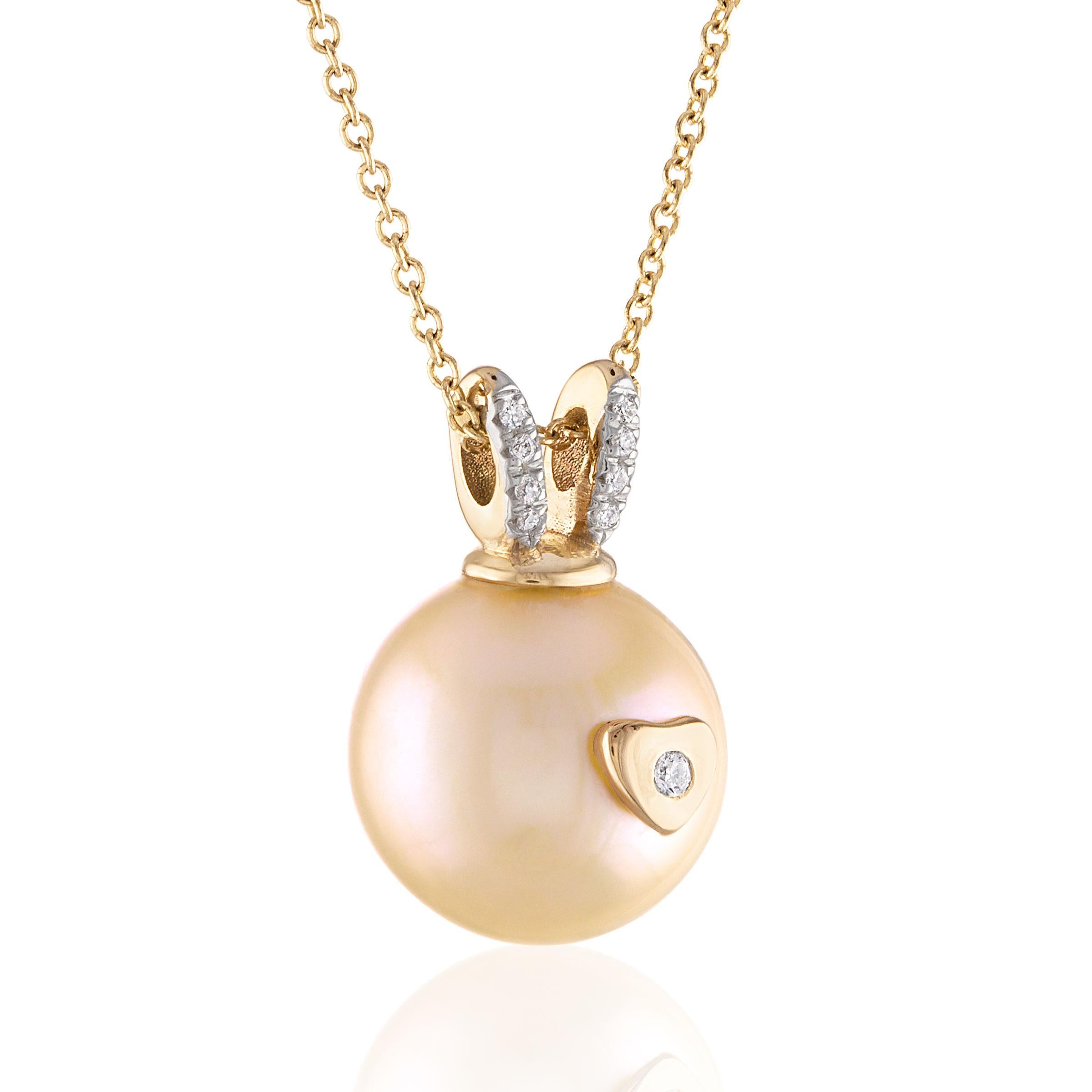 The necklace features approximately 12.3mm round Akoya pearl, 1.5mm round, brilliant cut diamond and 8 1.1mm round, brilliant cut diamonds weighing approximately 0.05 carat in total. The diamonds are F-G in color and VS2 in clarity. The chain is