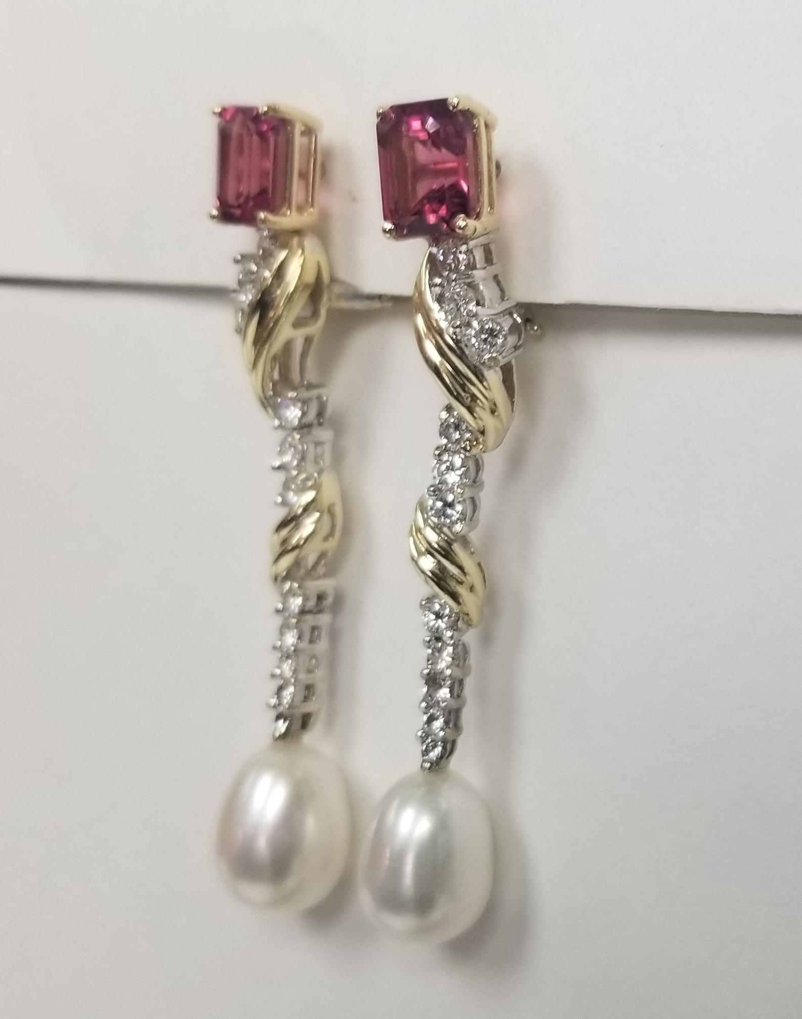  Specifications:
    main stone: 2 Pink Tourmaline weighing 3.61cts.
    DIAMONDS: 22 Diamonds 1.10cts.
    color: G
    clarity: VS
    brand: NONE
    metal: 14K yellow gold
    type: DROP EARringS
    weight:  11 GrS
    LENGTH: 2 INCH