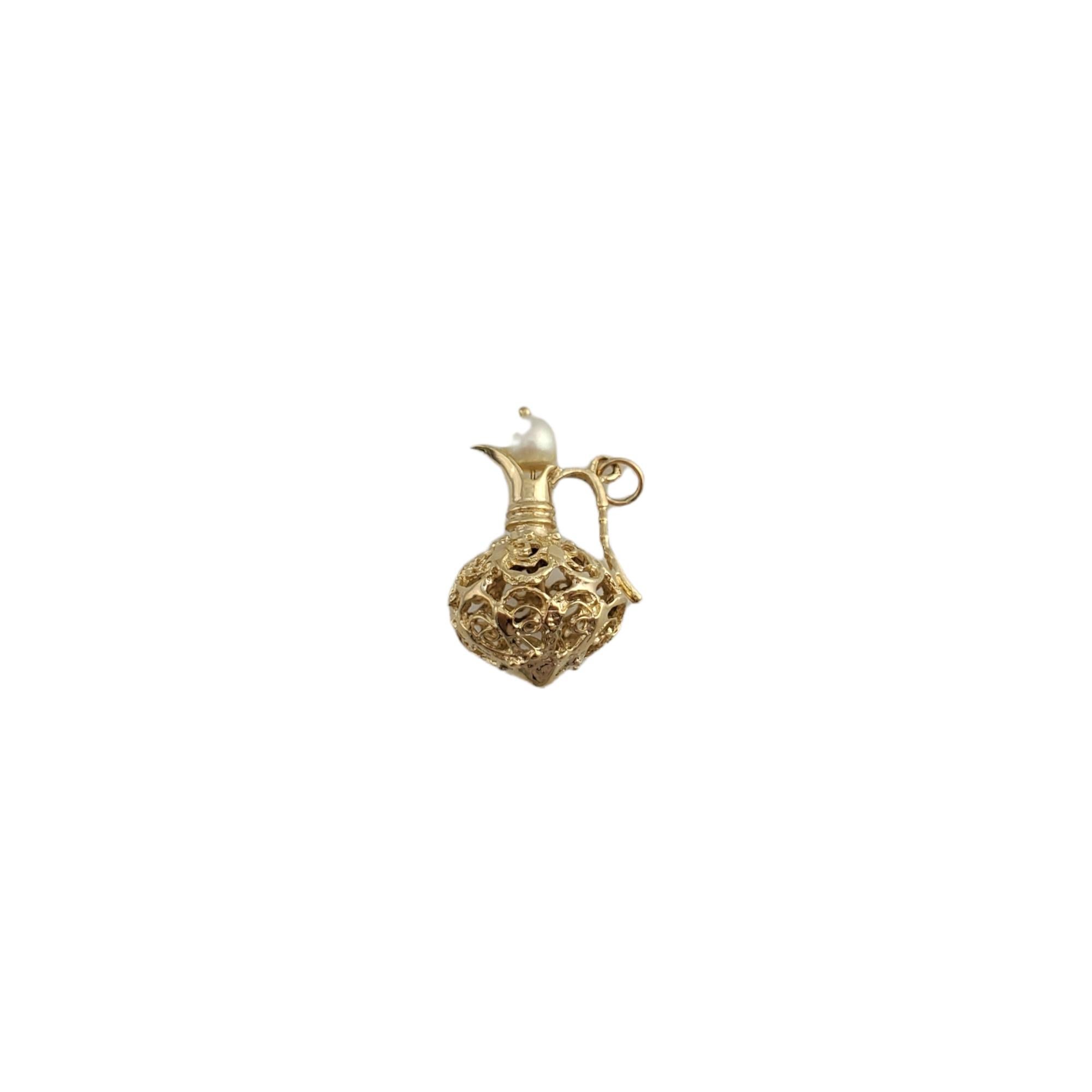 14K Yellow Gold Pitcher With Pearl Charm 

You'll love this beautiful yellow gold pitcher with pearl charm! 

Size: 19.19mm X 28.69mm

Weight:  5.3gr / 3.4 dwt

Very good condition, professionally polished.

Will come packaged in a gift box and will