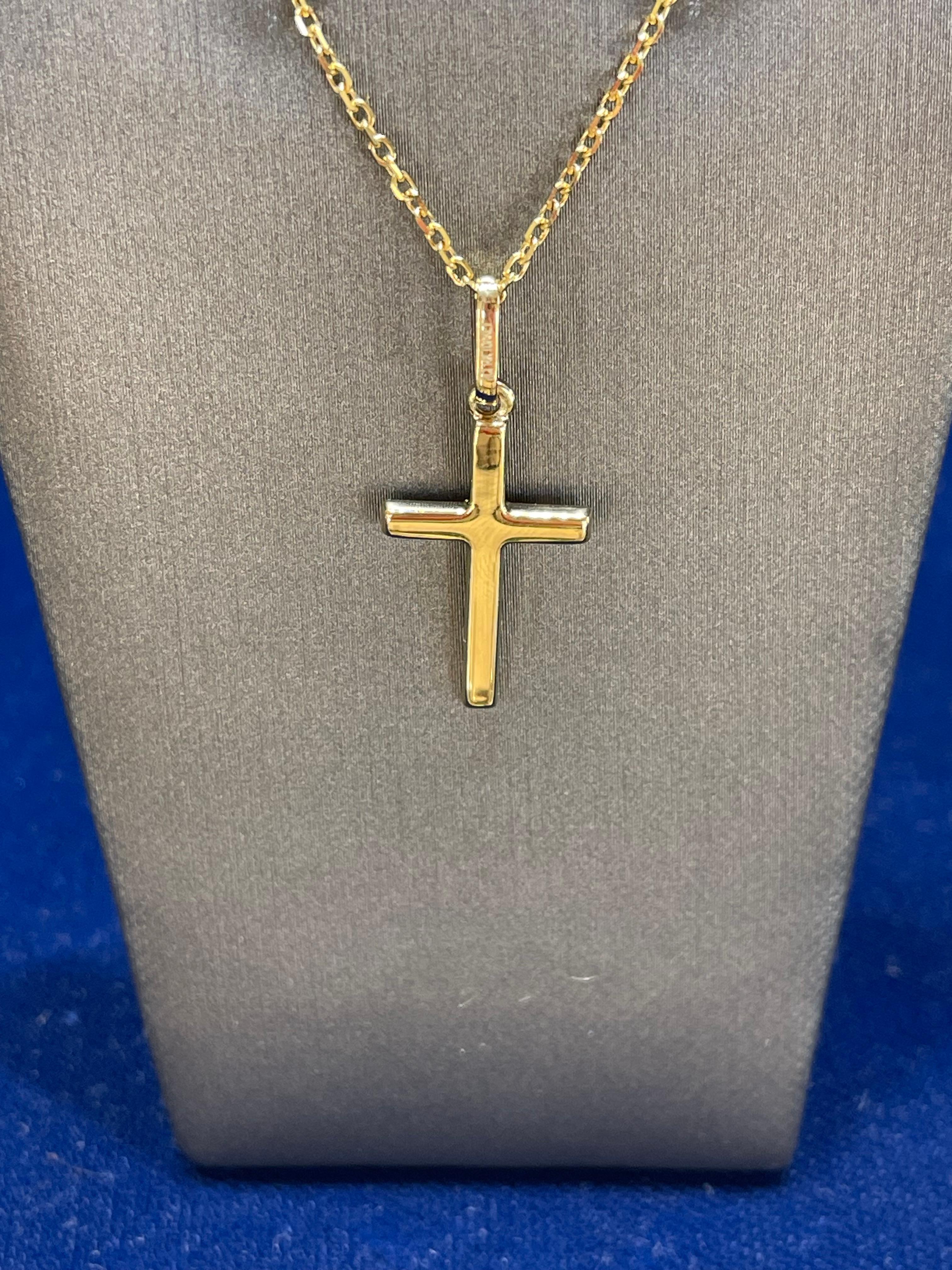 14k yellow gold plain cross necklace. The length of this necklace is 18 inches, the cross measures 20 x 12.6 mm, has a lobster clasp to open and close, and has a total weight of 3 grams.