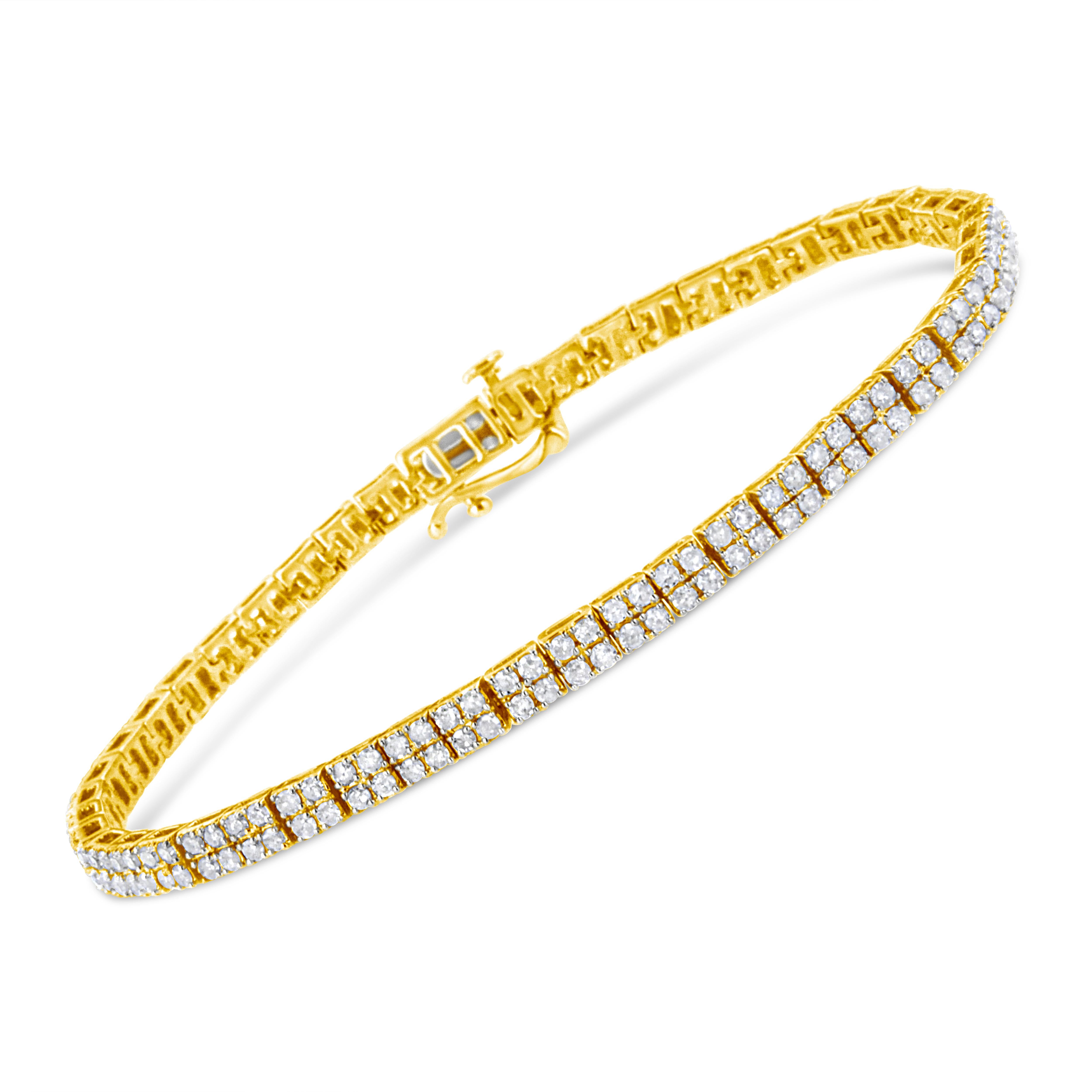 Modern yet timeless, this 14k yellow gold plated .925 sterling silver piece is a twist on the classic link bracelet. Yellow gold square links of 4 round-cut diamonds each make up the design of this everlasting piece. The diamonds sit in a striking