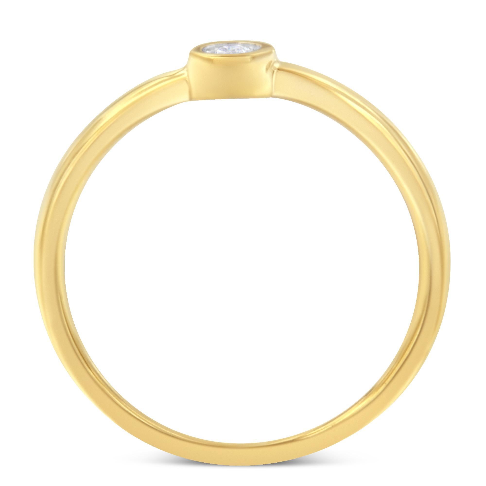 A diamond and yellow gold plated ring. The ring features a central round diamond miracle set in a 14 karat gold plated setting. The diamond weighs .05 carats.

Product Features:
 • Metal: .925 Yellow Sterling Silver with 14K Gold Plating
 • Average