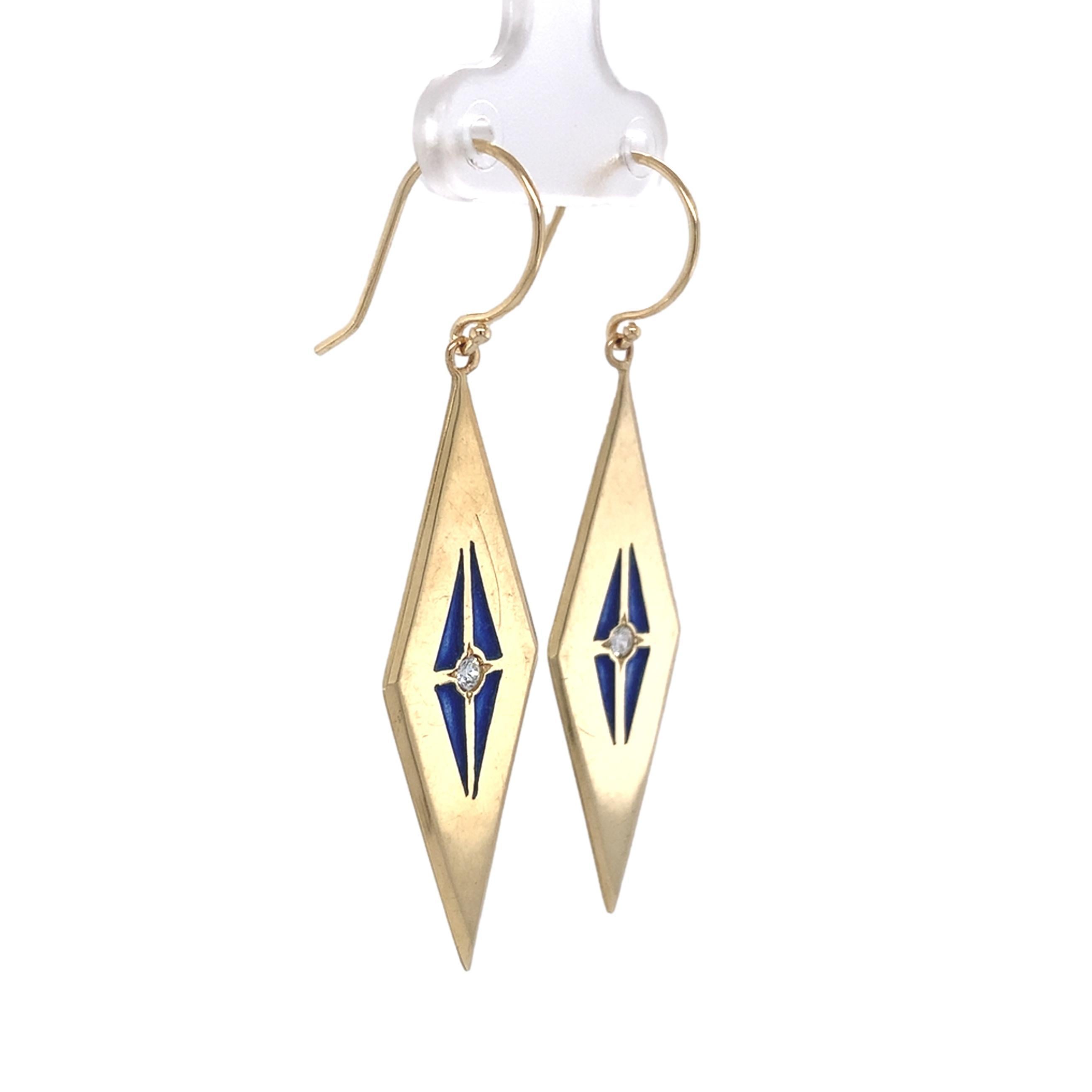 A pair of diamond and blue enamel dangle drop earrings. The earrings have stained glass type enamel called plique-a-jour. There are 2 earth mined genuine round brilliant cut diamonds measuring about 2.4mm. The earrings are a diamond shape measuring