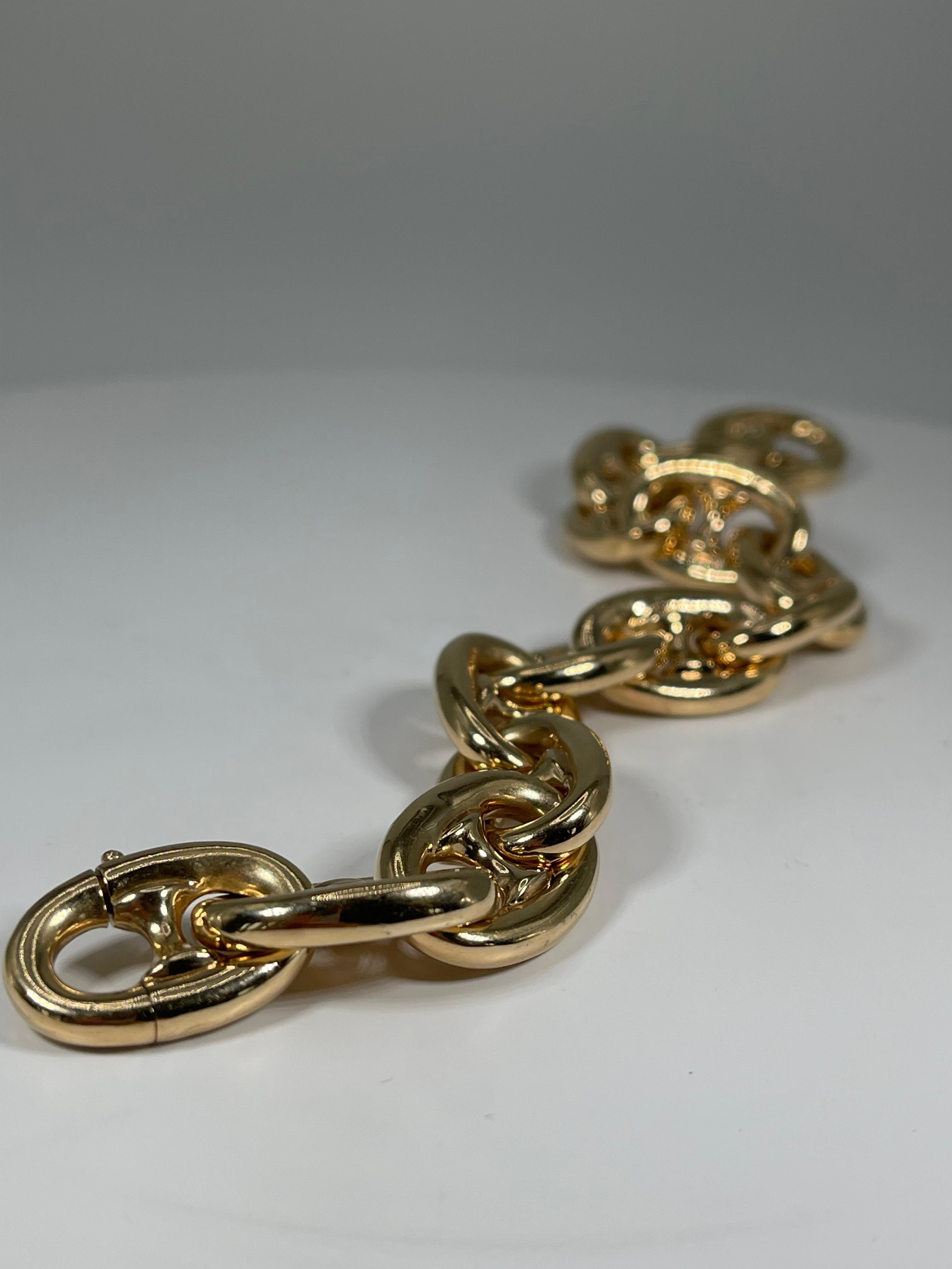 14k yellow gold puffed Gucci link Bracelet.  To open the bracelet, there is a twist clasp, The Links on the bracelet measure 16 x 23.3 mm, and the total weight of the bracelet is 36.3 grams.