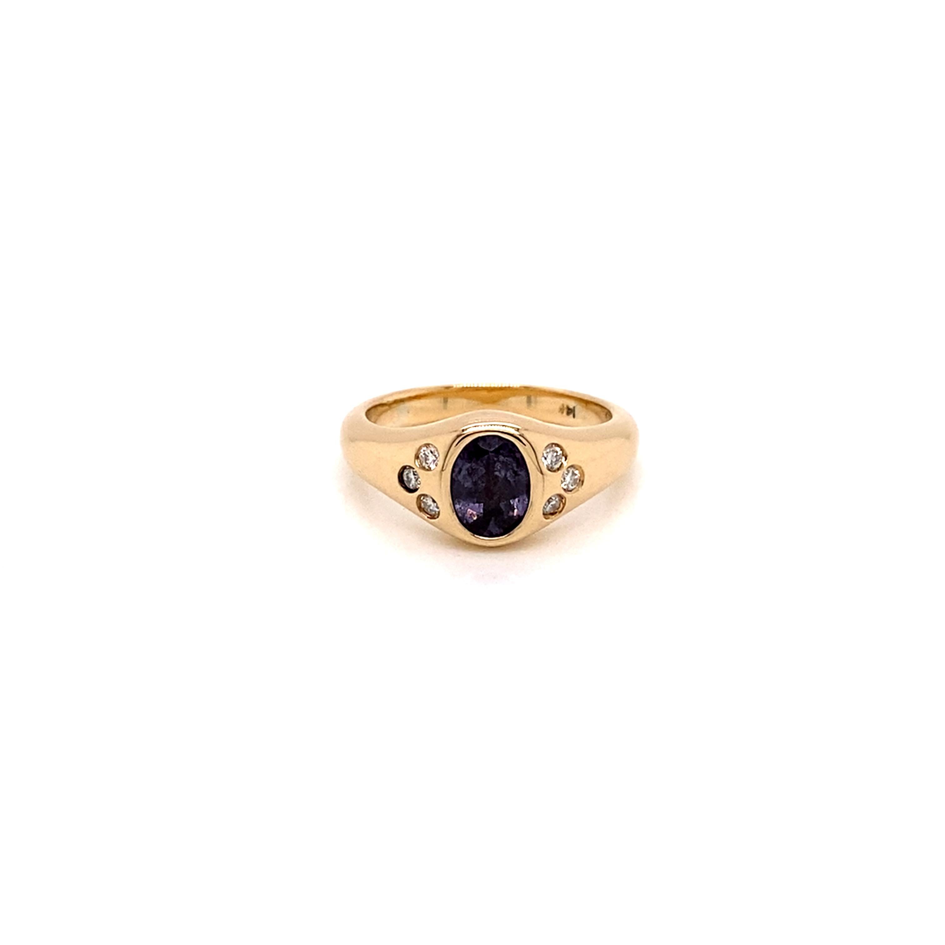 For a fresh take on an age old classic signet pinky ring, consider this eye-catching yellow gold and purple spinel and diamond version.

Featuring a beautiful smoky lavender purple hued oval spinel and 6 sparkling white diamonds all bezel set in a