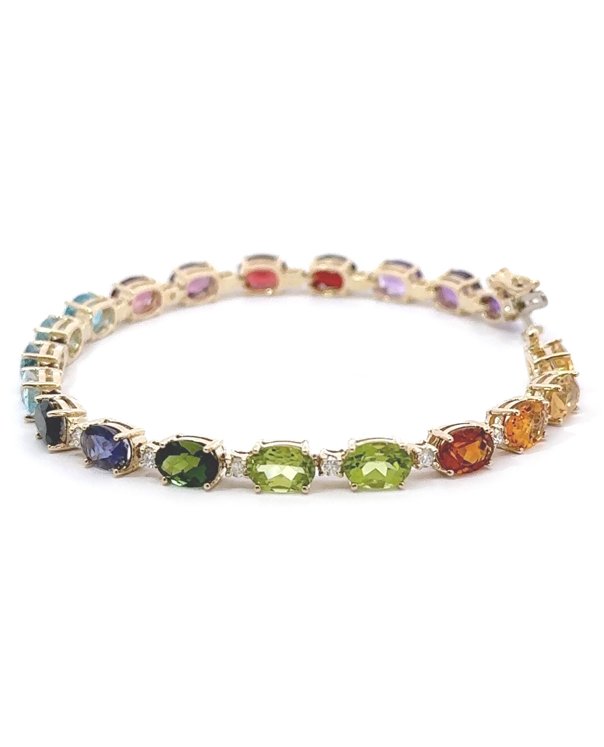 14K yellow gold line bracelet with 20 faceted oval shape semiprecious stones 15.48 carats total. 
The bracelet is also furnished with an additional 20 round brilliant-cut diamonds 0.65 carats total.

* 7 inches long
* Stones include amethyst,