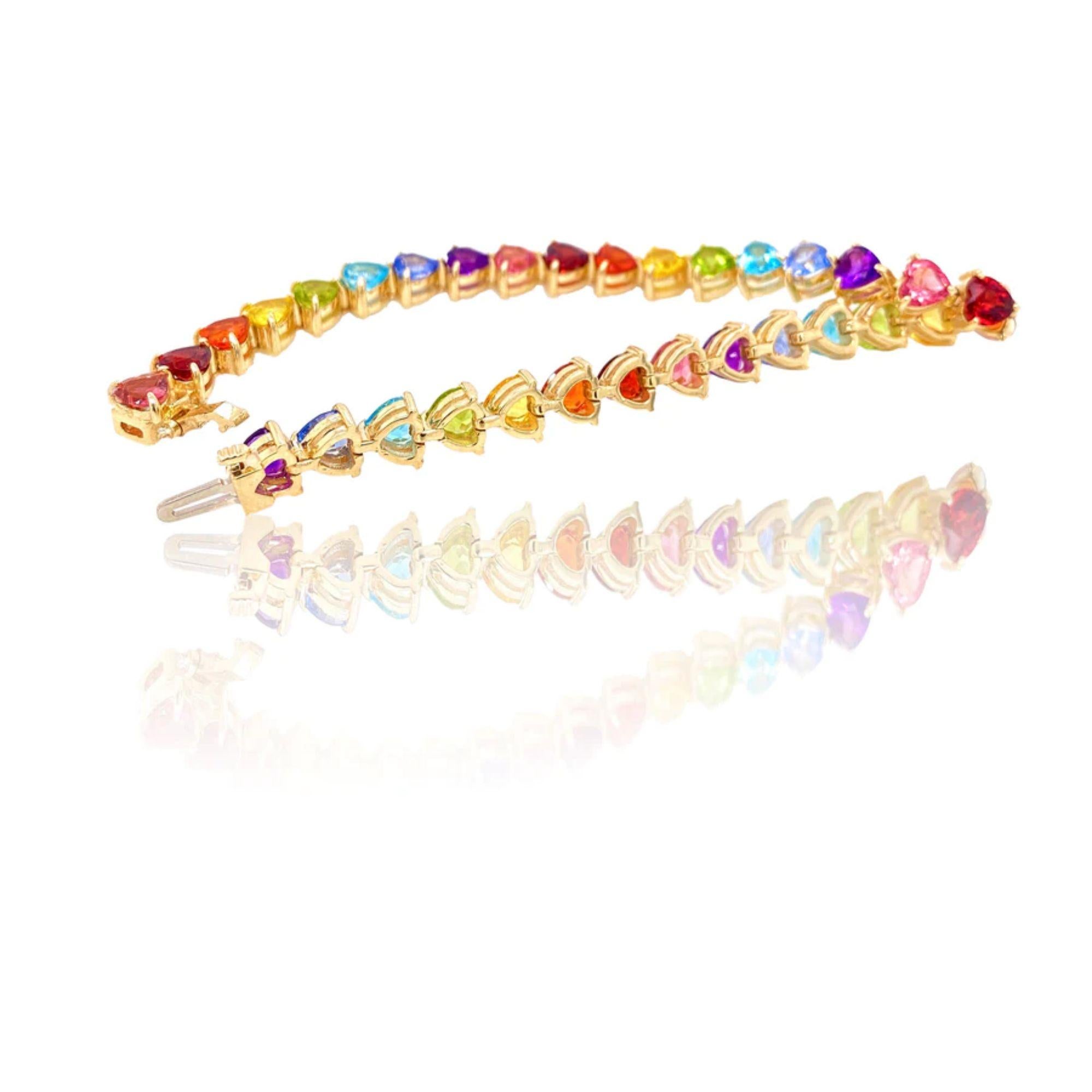 The full rainbow fantasy in the most unique and colorful bracelet to light up your life! This tennis bracelet is like no other consists of heart settings with colored gems and sapphires in the Classic Mordekai rainbow pattern. Goes perfect with our