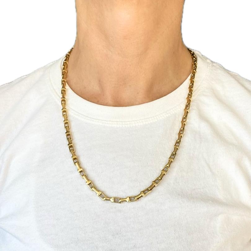 This 14k yellow gold chain necklace features a repeating pattern of solid rectangular bars connected by open rectangular links, creating a clean, geometric look. At 22 inches long and approximately 3/16 inch wide, it has a substantial presence that