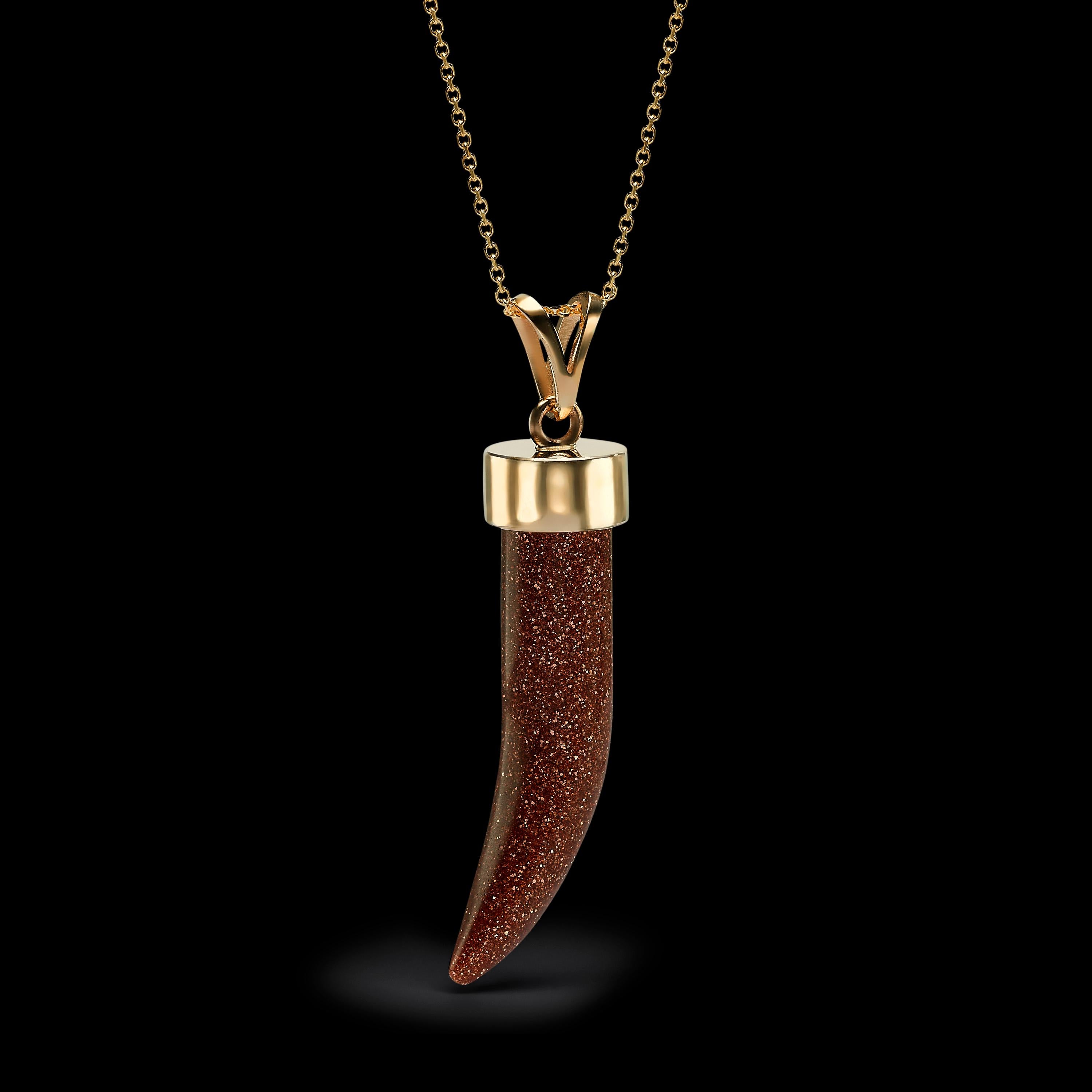 Our Handcrafted unisex Goldstone horn spike pendant is set on 14K yellow gold and represents a cosmic energy Jewel.
Goldstone is a known for its power of inspiration and for its ability to transmute ideas into manifestation of life power.
The