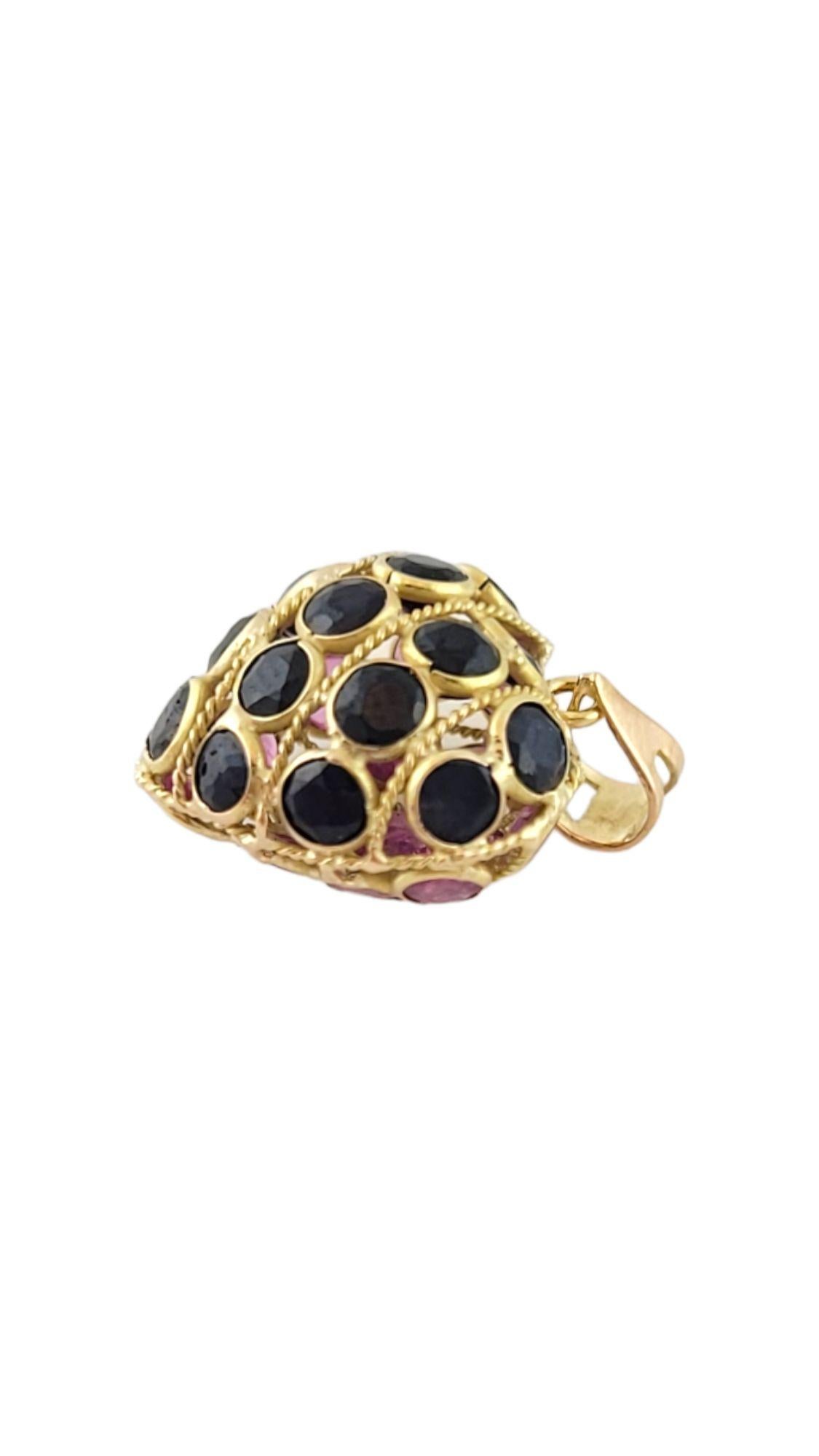 This adorable 14K gold heart charm has 15 blue natural sapphire stones on one side and 15 beautiful natural ruby stones on the other!

Size: 15.1mm X 14mm X 8.8mm

Length w/ bail: 19.5mm

Weight: 1.4 g/ 0.9 dwt

Hallmark: 14K

Very good condition,