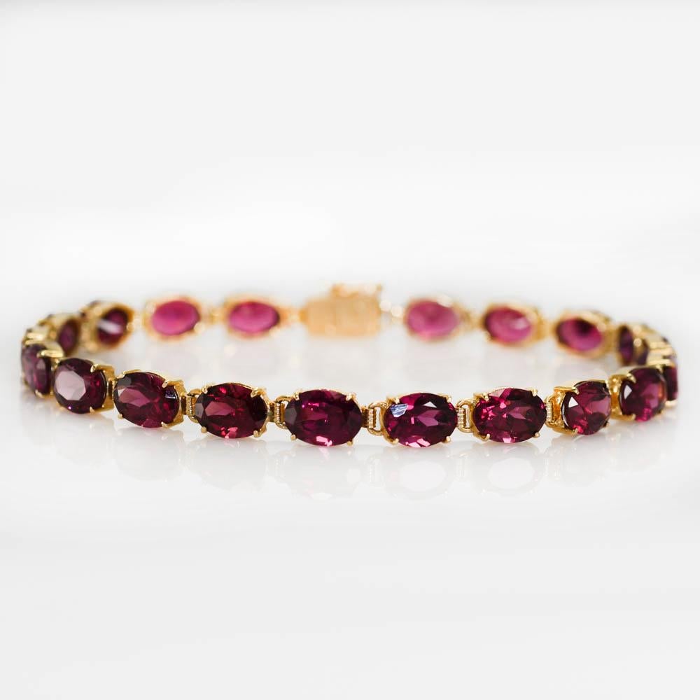 14K Yellow Gold Rhodolite Garnet Bracelet, 9.7g
14k yellow gold and rhodolite garnet tennis bracelet. 

Stamped 14k and weighs 9.7 grams gross weight.

The oval shape garnets are a light purplish-red color, approximately 1.00ct or more per stone,