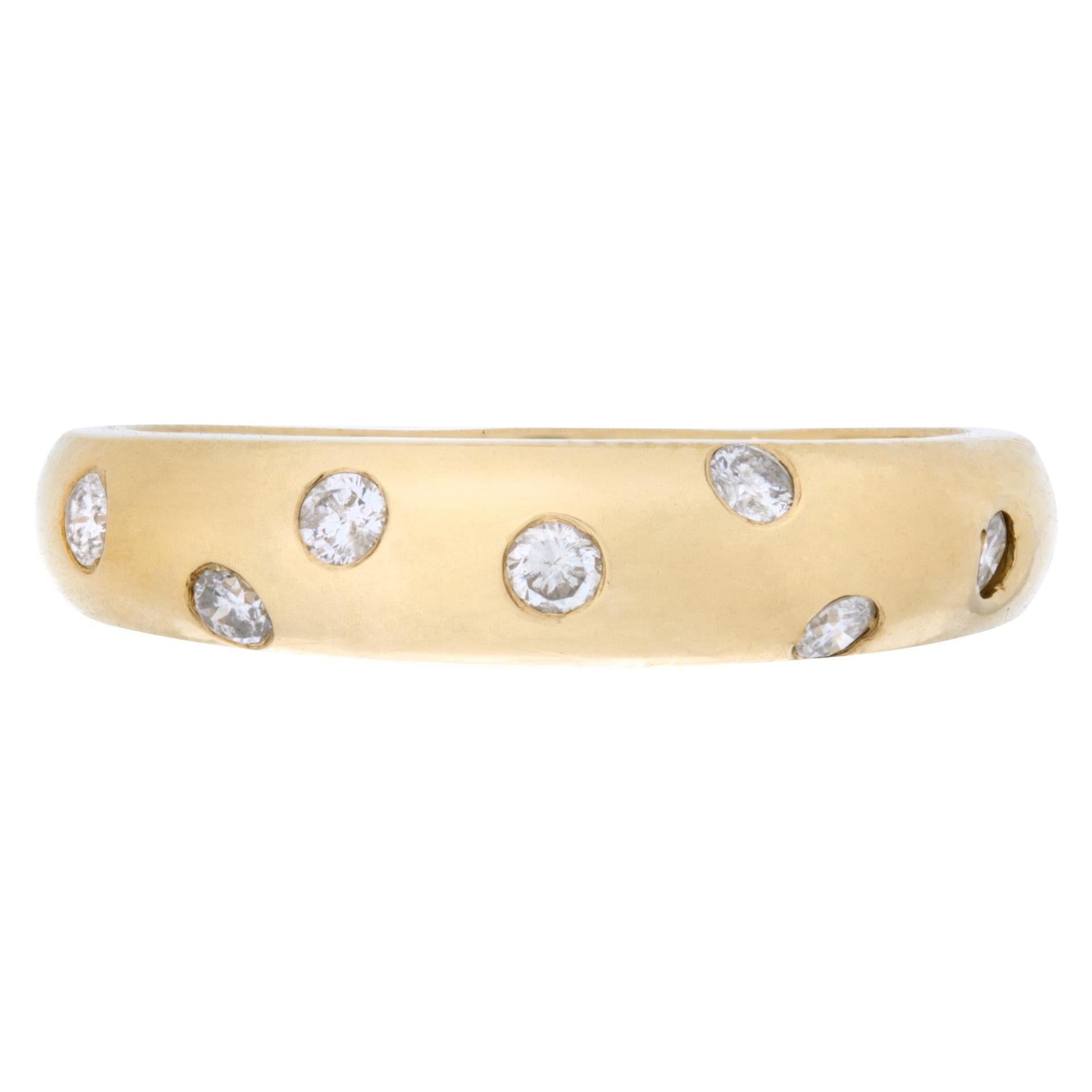 Bezel set diamond ring in 14k yellow gold with 0.14 carats in round brilliant diamonds. Size 8This Diamond ring is currently size 8 and some items can be sized up or down, please ask! It weighs 2.4 pennyweights and is 14k.
