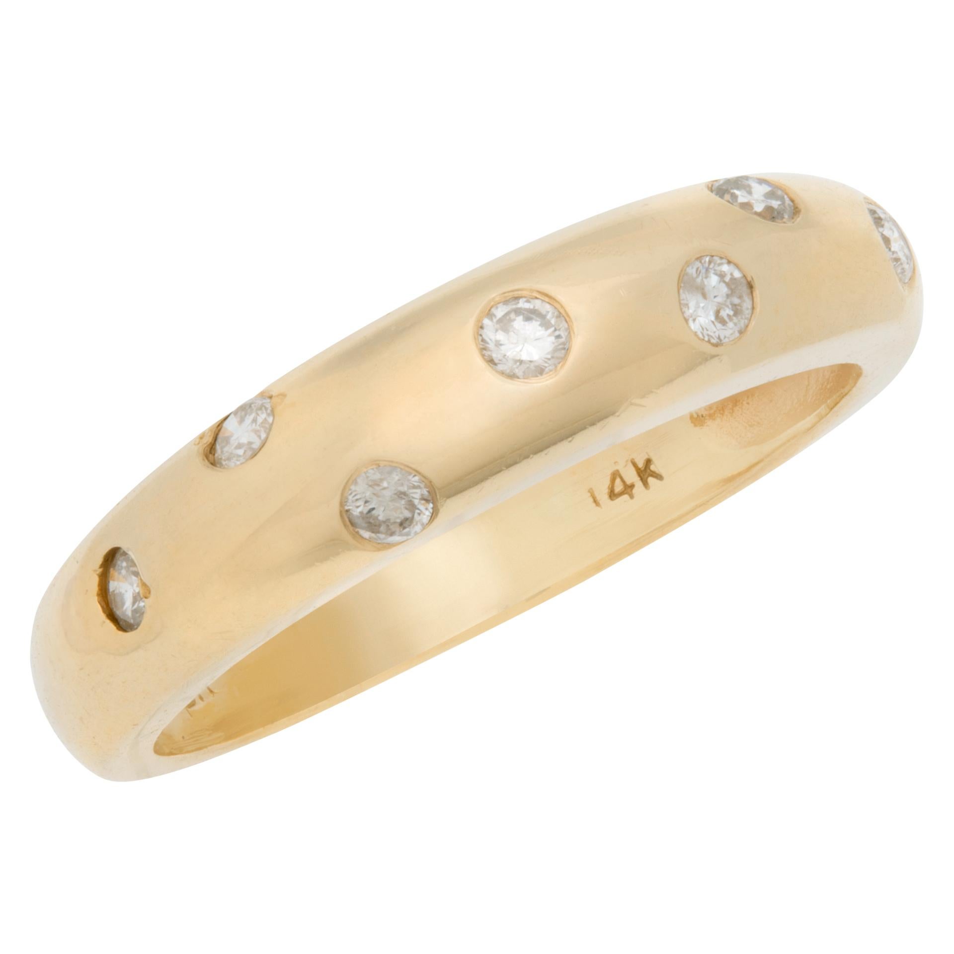 gold band with inset diamonds