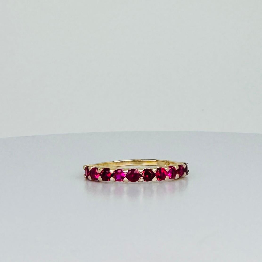 Add a touch of vibrant elegance to your collection with this stunning 14k gold ring, featuring brilliant-cut red tourmalines. This ring combines classic gold craftsmanship with the vivid allure of red tourmalines, making it a standout piece for any