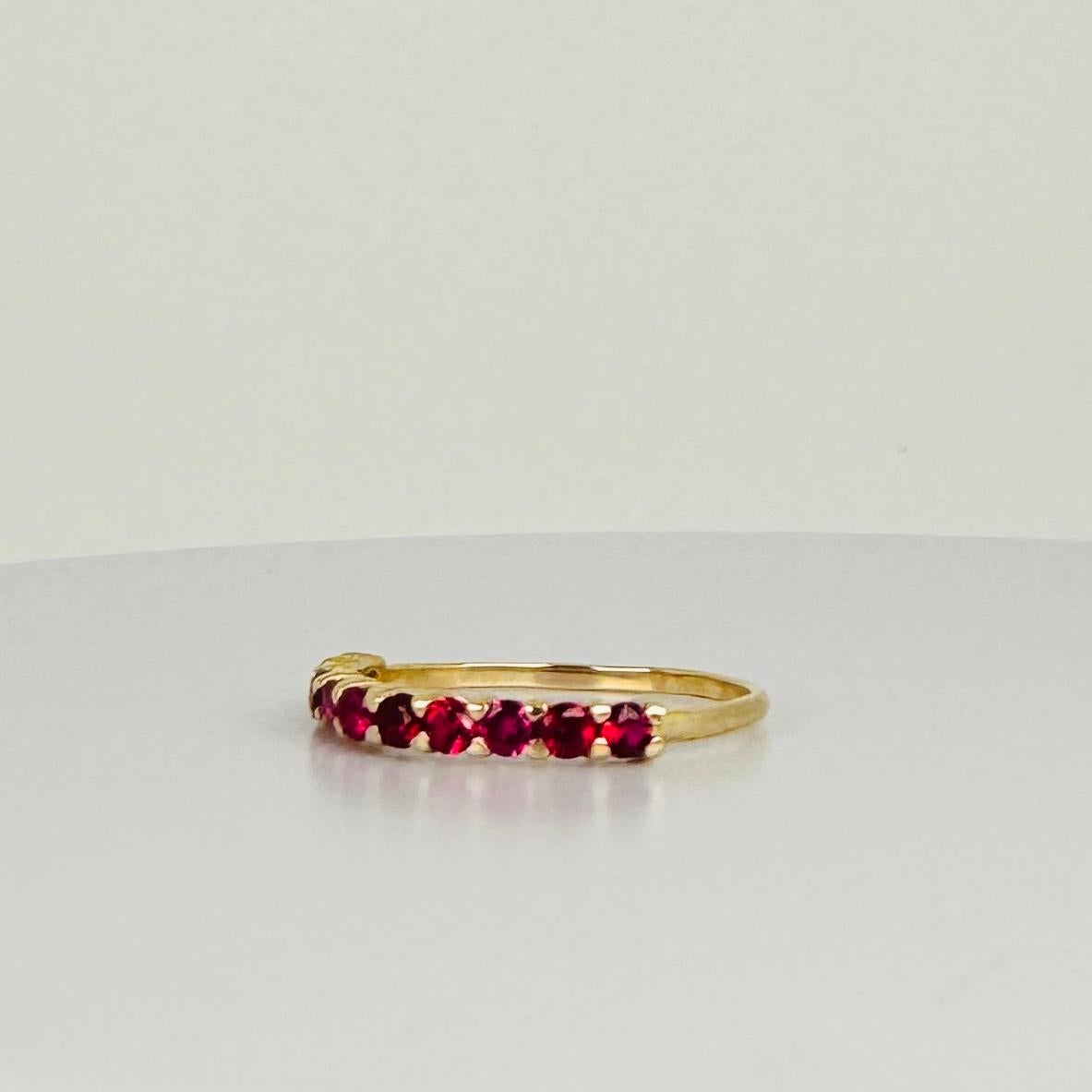 Women's 14k yellow gold ring with 10 brilliant cut red tourmalines