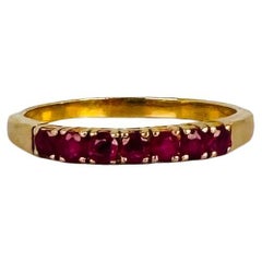 Bague en or jaune 14k avec 10 tourmalines rouges taille brillant