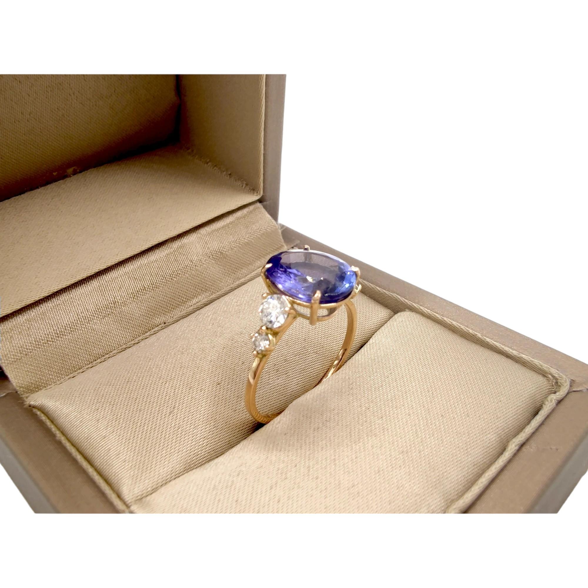 14K yellow  Gold Ring with 2.24 Carat oval Tanzanite and Diamonds For Sale 3