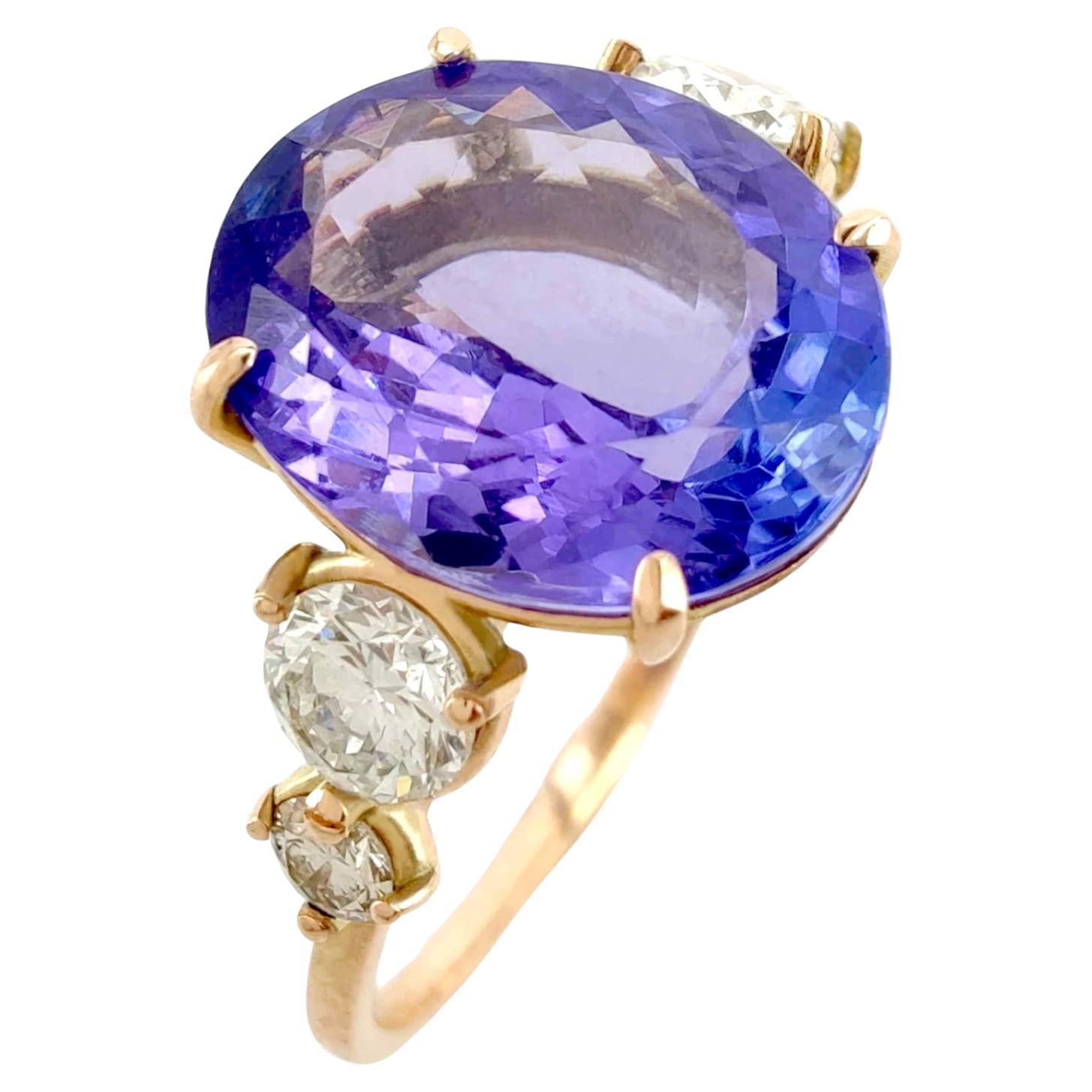 14K yellow  Gold Ring with 2.24 Carat oval Tanzanite and Diamonds For Sale