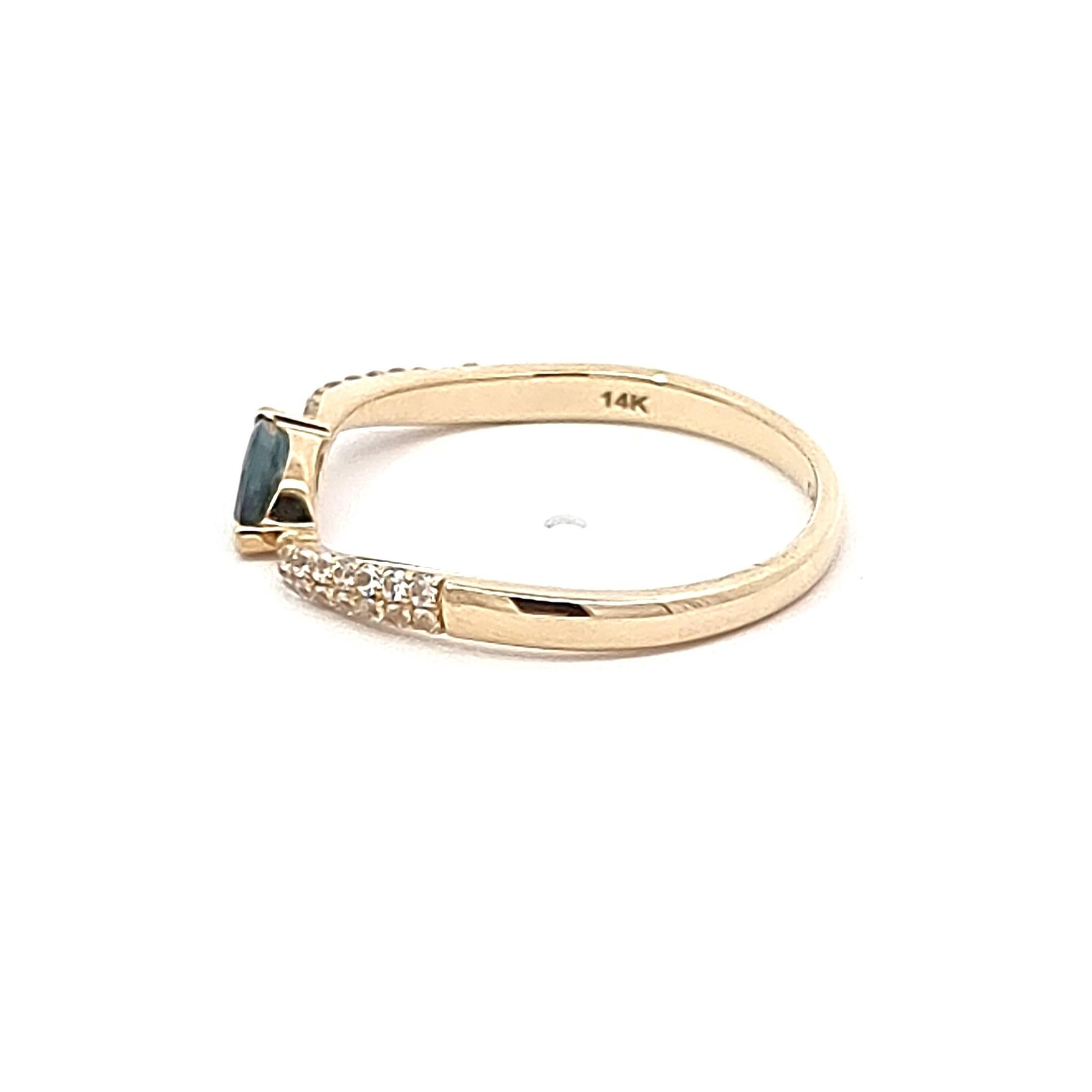 Elevate your style with our exquisite 14K Yellow Gold Ring, a harmonious blend of sophistication and charm. The marquise blue sapphire, the focal point of this captivating piece, commands attention with its vivid allure, weighing 0.24 carats. The