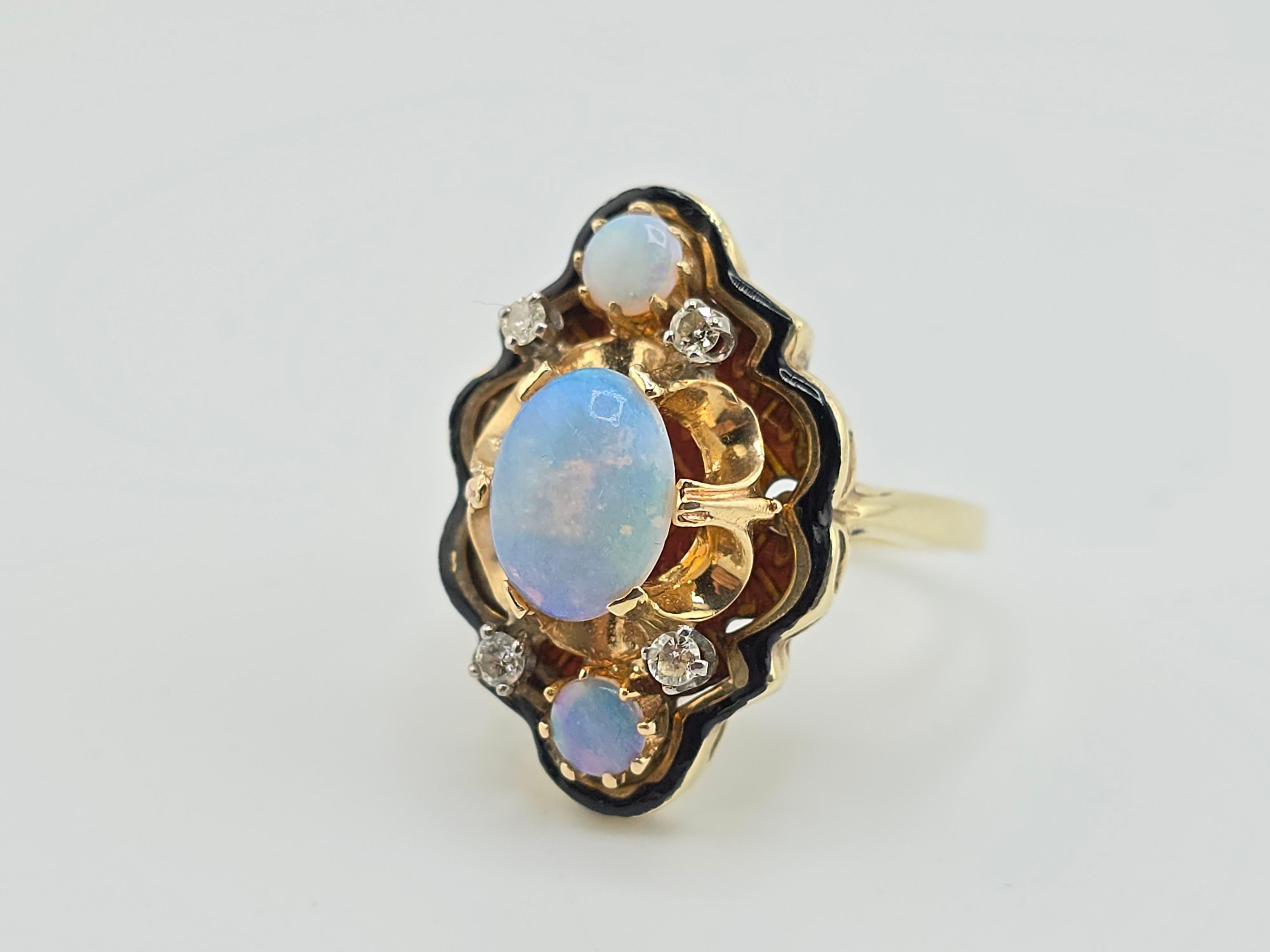Elevate your jewelry collection with this stunning 14K yellow gold ring featuring natural opals and diamonds. The intricate design is inspired by nature, with a focus on the captivating opal stones that reflect a rainbow of colors. The ring is