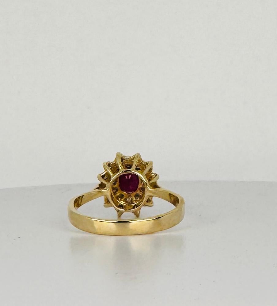 14k yellow gold ring with oval cut natural ruby and 24 brilliant cut diamonds For Sale 1