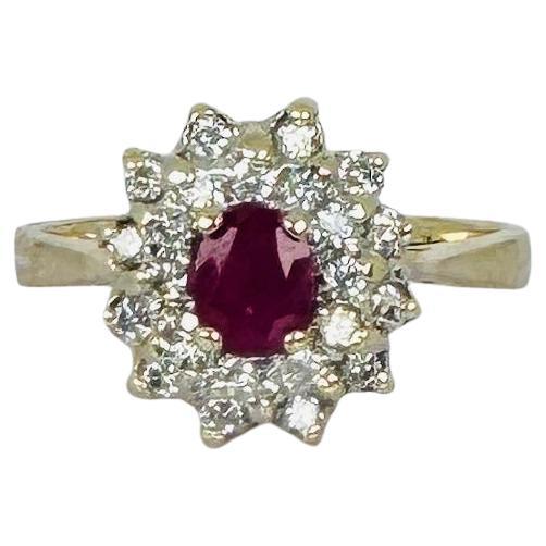 14k yellow gold ring with oval cut natural ruby and 24 brilliant cut diamonds For Sale