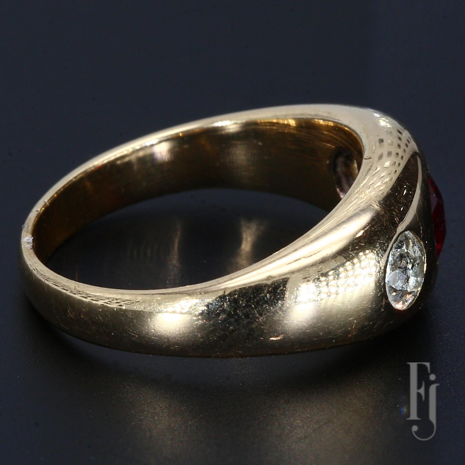 A 14k Yellow Gold Ring with a ~0.5ct Garnet Center Stone and Two Bezel Set Diamonds weighing ~0.15cts each.

Size - 6.25
Total Weight - 6.35g
A90