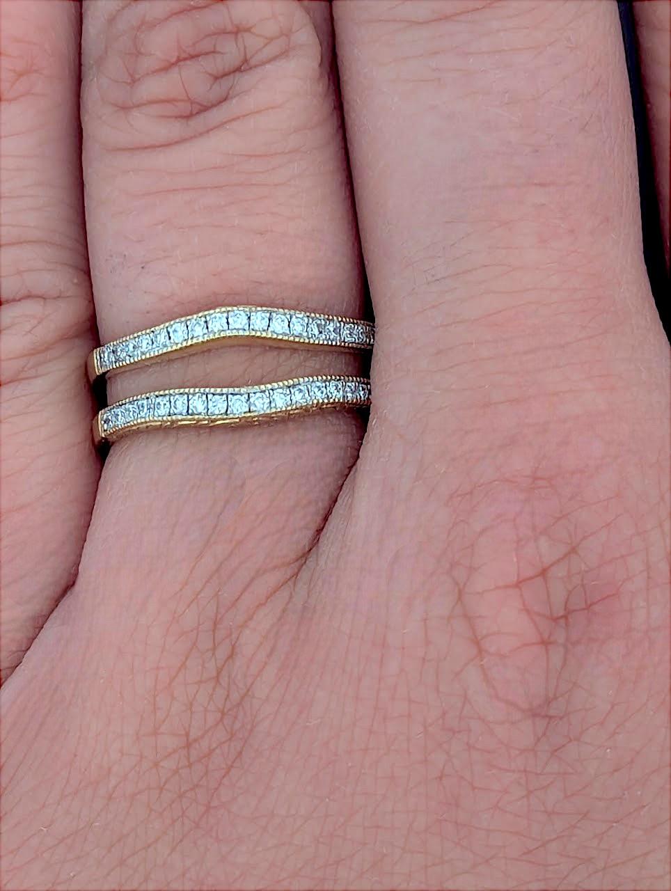This elegant 14K yellow gold ring wrap features .25 CTW of natural round diamonds, designed to frame and enhance your solitaire or engagement ring with extra brilliance. The open design allows it to hug your center ring seamlessly, creating a