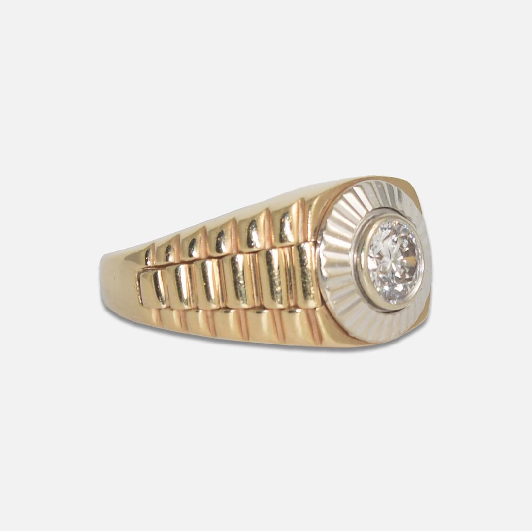 Men's diamond ring in 14k yellow gold setting with Rolex watch style design.
Stamped 14k and tests 58% gold with an XRF analyzer. 8.9 grams gross weight.
The diamond is a round brilliant cut, .75 carats, H to I color, Vs clarity, and good