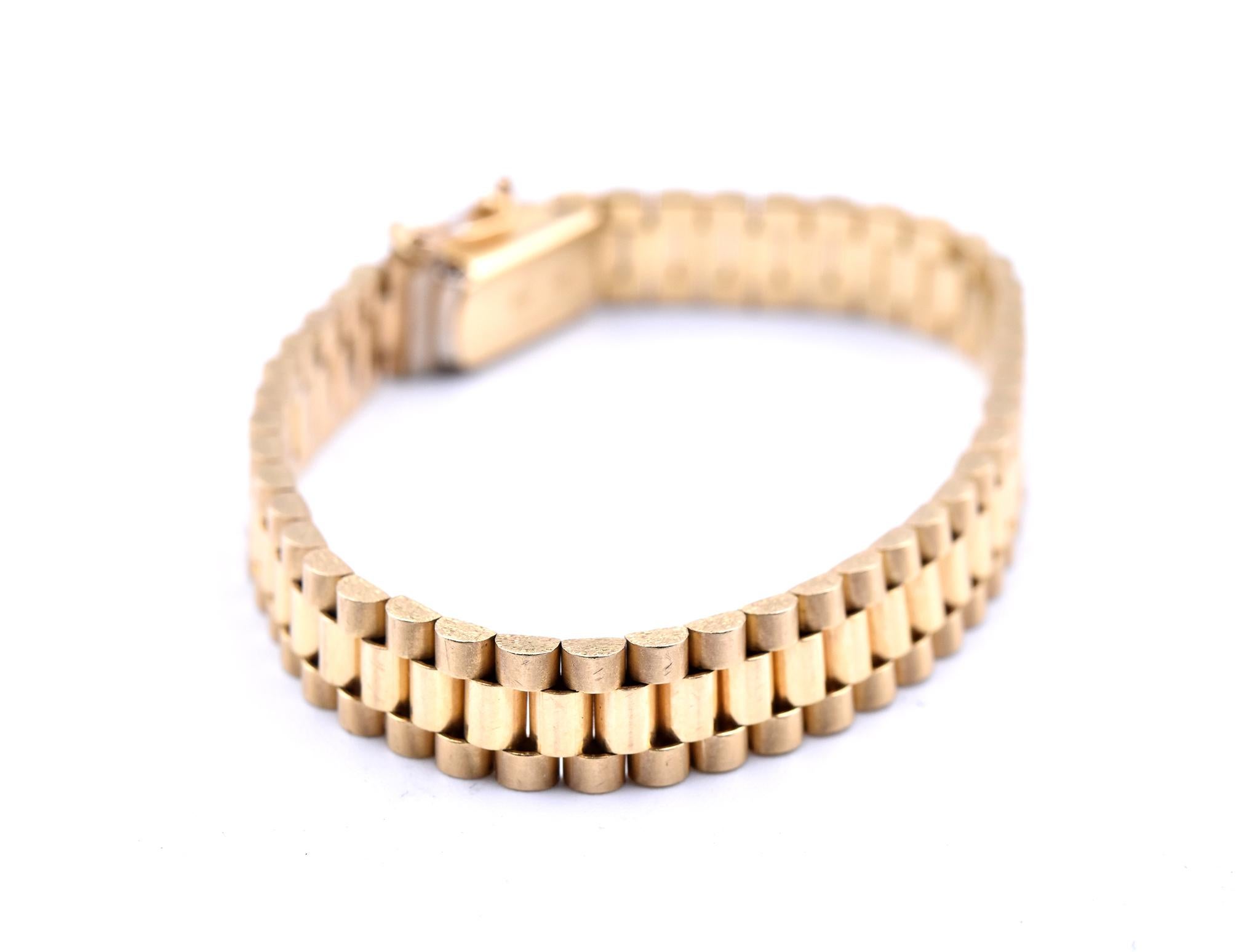 Designer: custom design
Material: 14k yellow gold
Dimensions: bracelet is 5-inches long, 6.51mm wide
Weight: 12.09 grams
