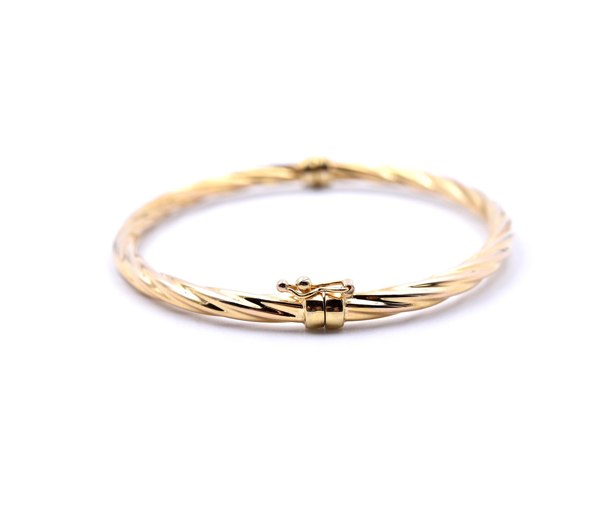 Designer: custom
Material: 14k yellow gold
Dimensions: bracelet is approximately 7-inches long, measures 4.10mm in width
Weight: 5.71 grams
