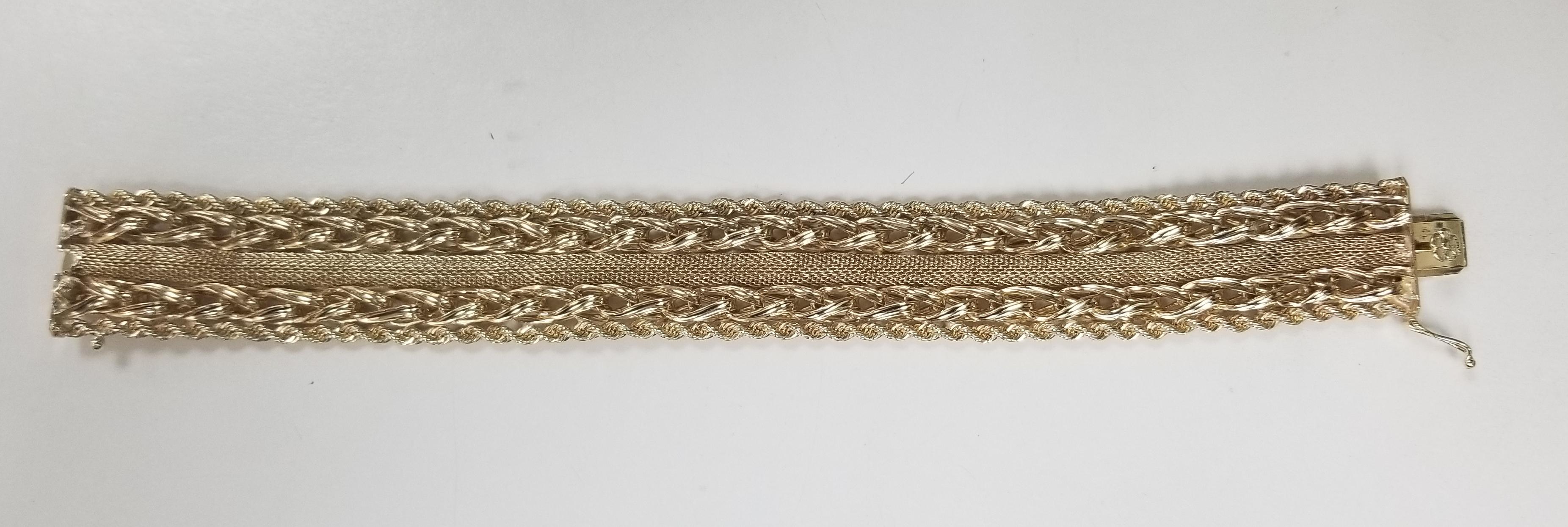 14k yellow gold rope, link and mesh 1 inch wide bracelet, the bracelet measures 8 inches and weighs 72.52 grams.