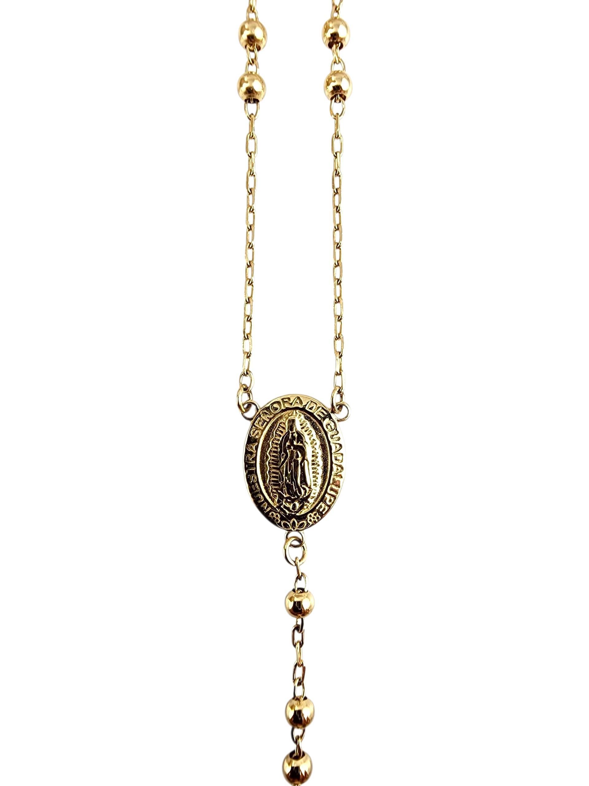 14K Gelbgold Rosenkranz Perlen

Dieser Rosenkranz aus 14 Karat Gelbgold ist ein wunderschön gearbeitetes Symbol des Glaubens und der Hingabe. Mit ihren polierten Perlen, einem zarten Kruzifix und einer zentralen Medaille verbindet sie spirituelle