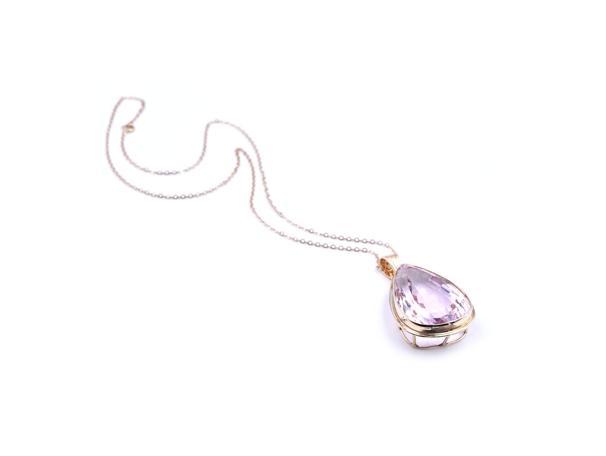 Designer: custom design
Material: 14k yellow gold
Kunzite: pear cut= 56.09ct
Dimensions: necklace is 15 ½ -inch long, pendant is 40mm by 22.40mm
Weight: 13.93 grams
