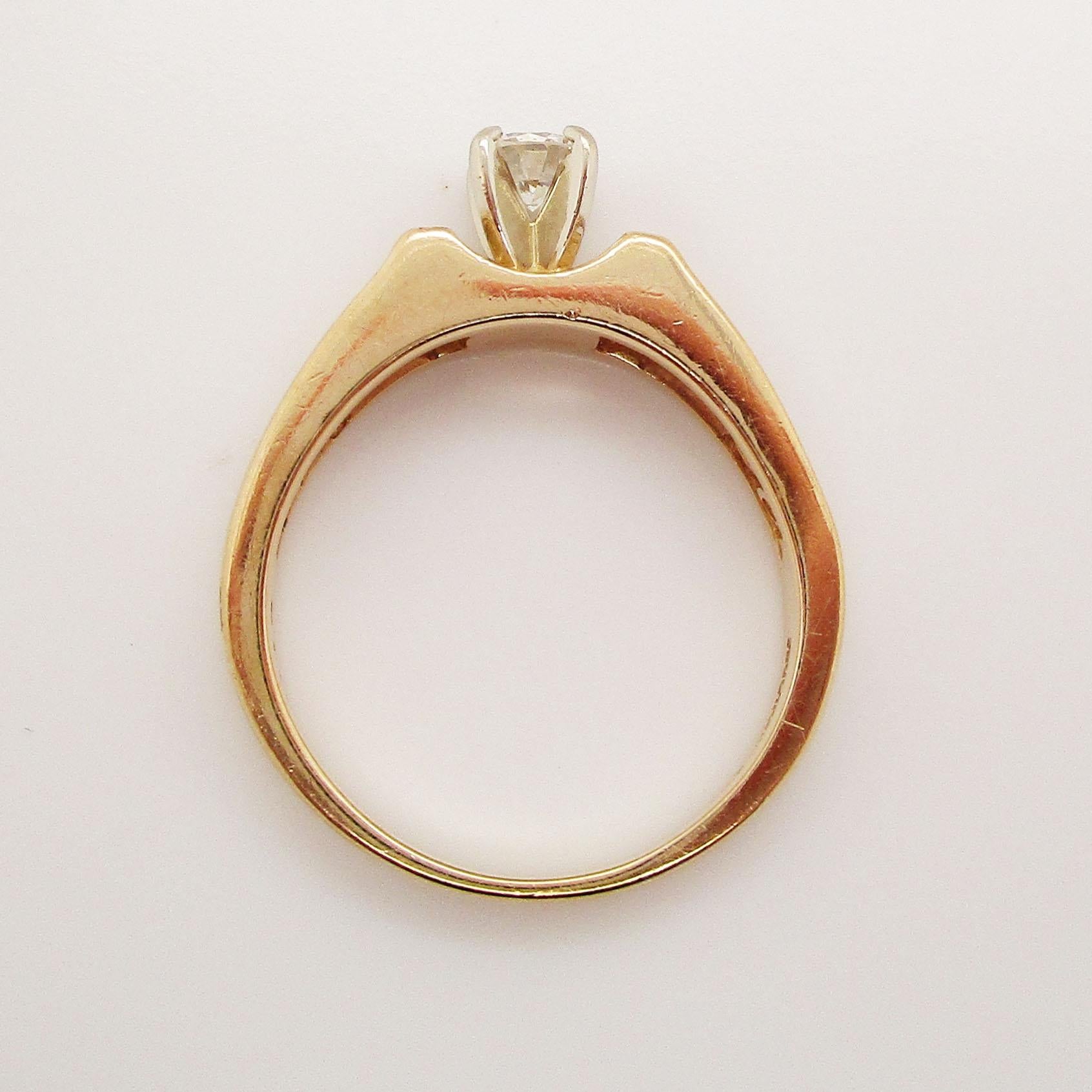 Modern 14 Karat Yellow Gold Round and Baguette Diamond Engagement Ring