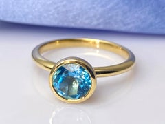14K Yellow Gold Round Bezel Set Swiss Blue Topaz Solitaire Ring