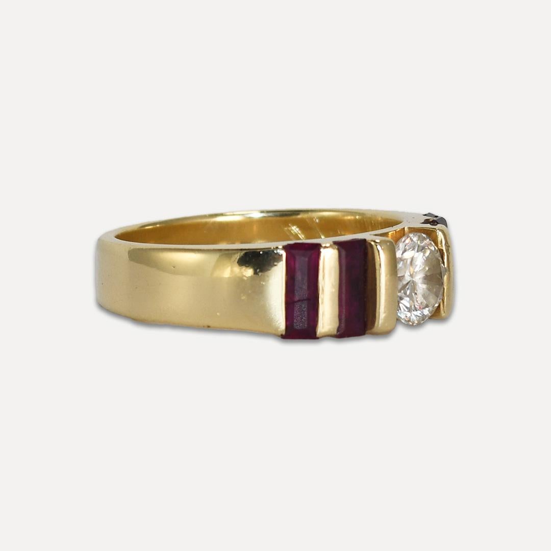 Ladies' diamond and ruby ring in 14k yellow gold setting.
Tests 14k and weighs 8.7 grams gross weight.
The diamond is a round brilliant cut, measuring 6.2mm and 3.87mm deep, measuring .90 carats using a leverage gauge.
The color is j to k color, i1