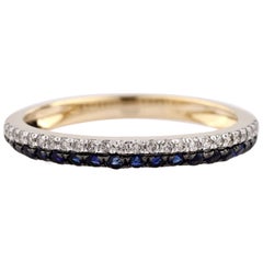 Anillo de oro amarillo de 14 quilates con banda redonda entrecruzada y diamantes