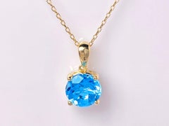 14K Yellow Gold Round Cut Blue Topaz Solitaire Brilliance Pendant