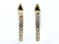 Pendientes de aro tipo «huggie» de oro amarillo de 14 quilates con diamantes de talla redonda
