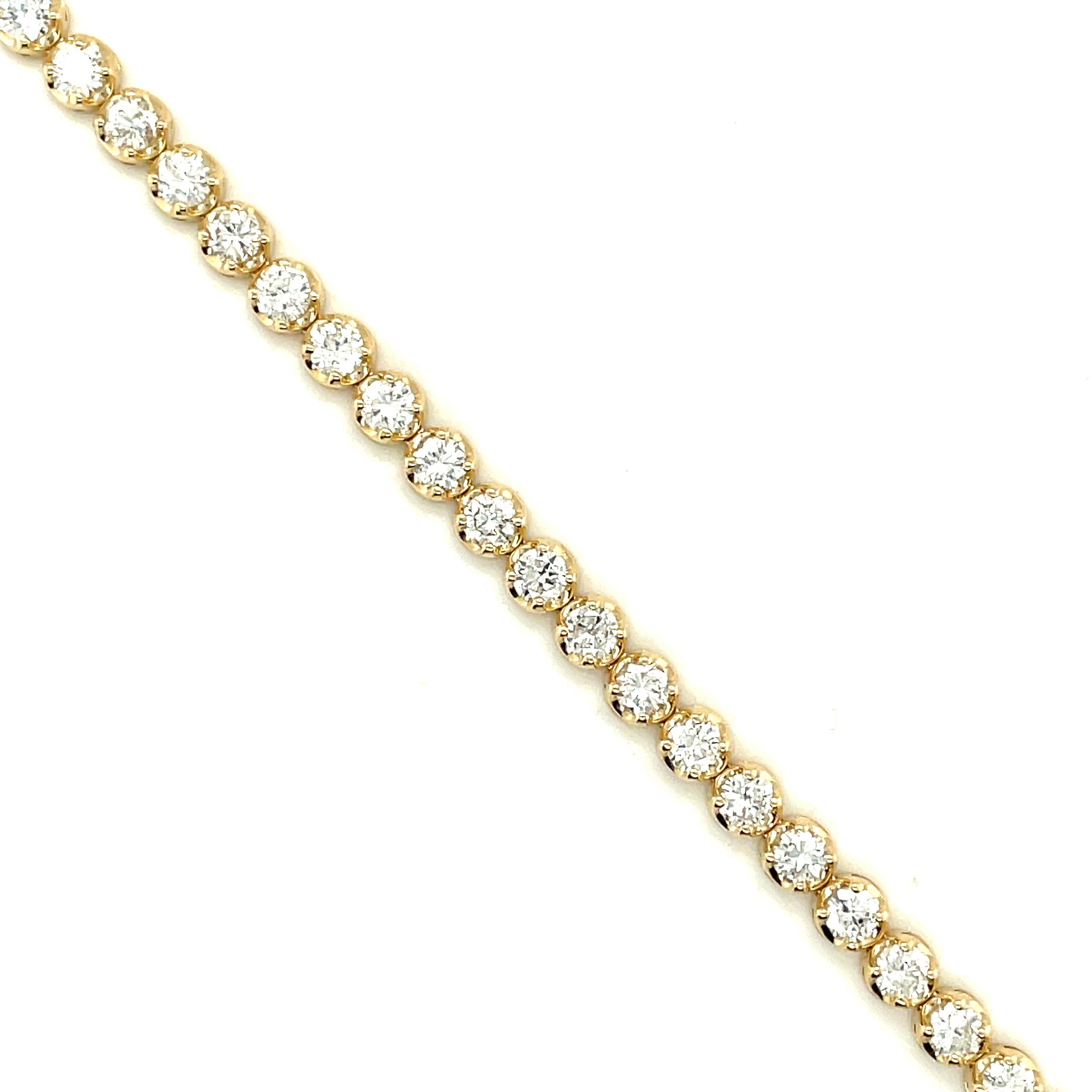 14K Yellow Gold Round cut Diamond Tennis Bracelet 

Diamonds:
4.8 carats
11 pointers
H color, VS stones

Buttercup Setting in 14K Gold

Grams 8.9