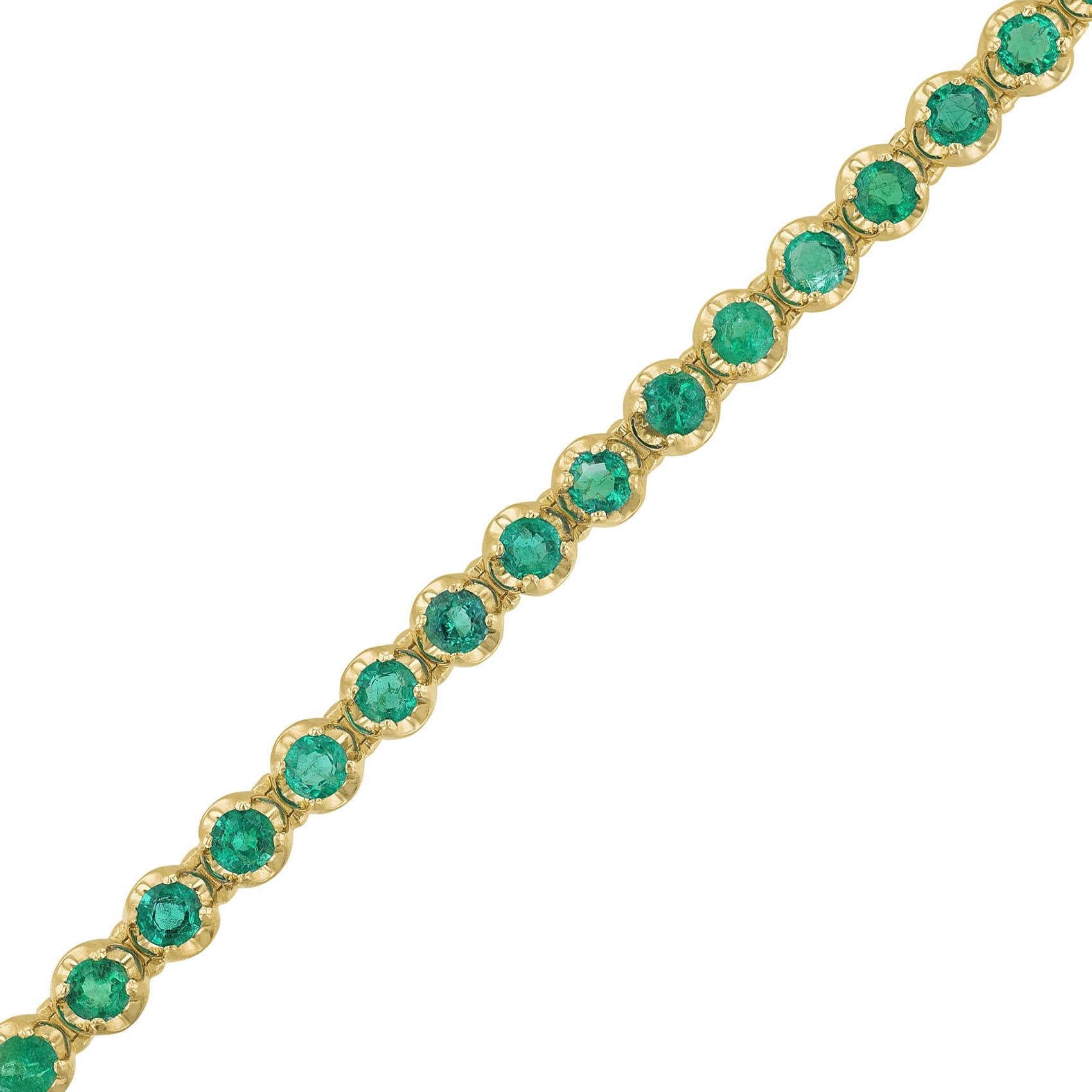 This bracelet is made in 14K yellow gold. It features 35 round cut emeralds weighing 4.18 carats. All stones are prong set. 
