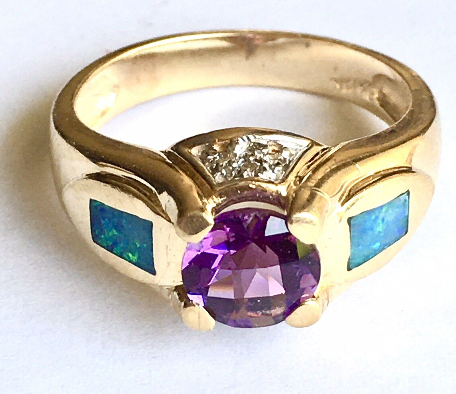 14k Yellow Gold Round Faceted Amethyst, Opal Inlay and Diamond Ring 
Finger Size: 9
Design: inlay
Condition: in very good condition, see pictures  

one natural Round 7mm faceted Checkers cut Amethyst, eight pieces round full cut diamond, weighting