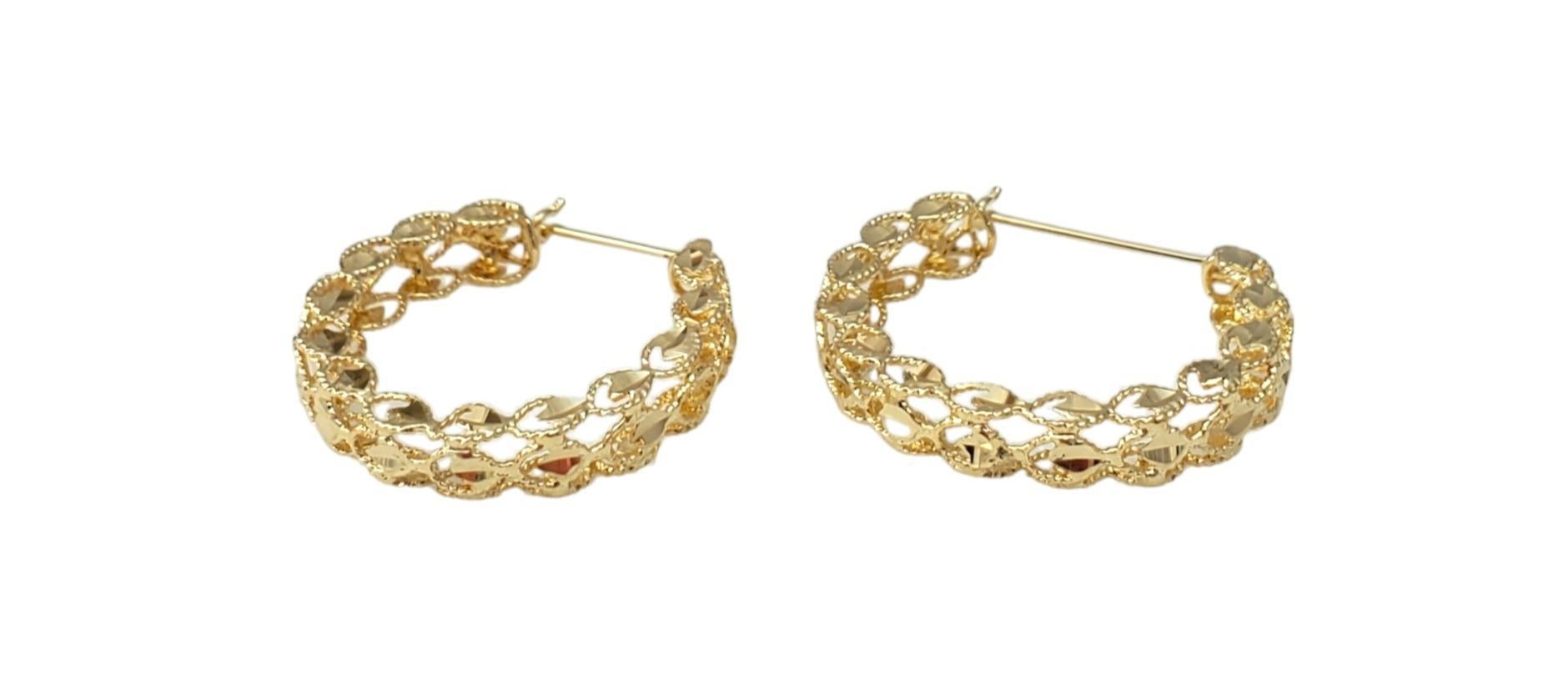 Vintage 14K Yellow Gold Faceted Hoops - 

These timeless hoop earrings are a stunning accessory. 

Size:  24mm X 26mm

Weight:  3.3 dwt. /  5.1 gr.

Very good condition, professionally polished.

Stamped 14K

Will come packaged in a gift box or