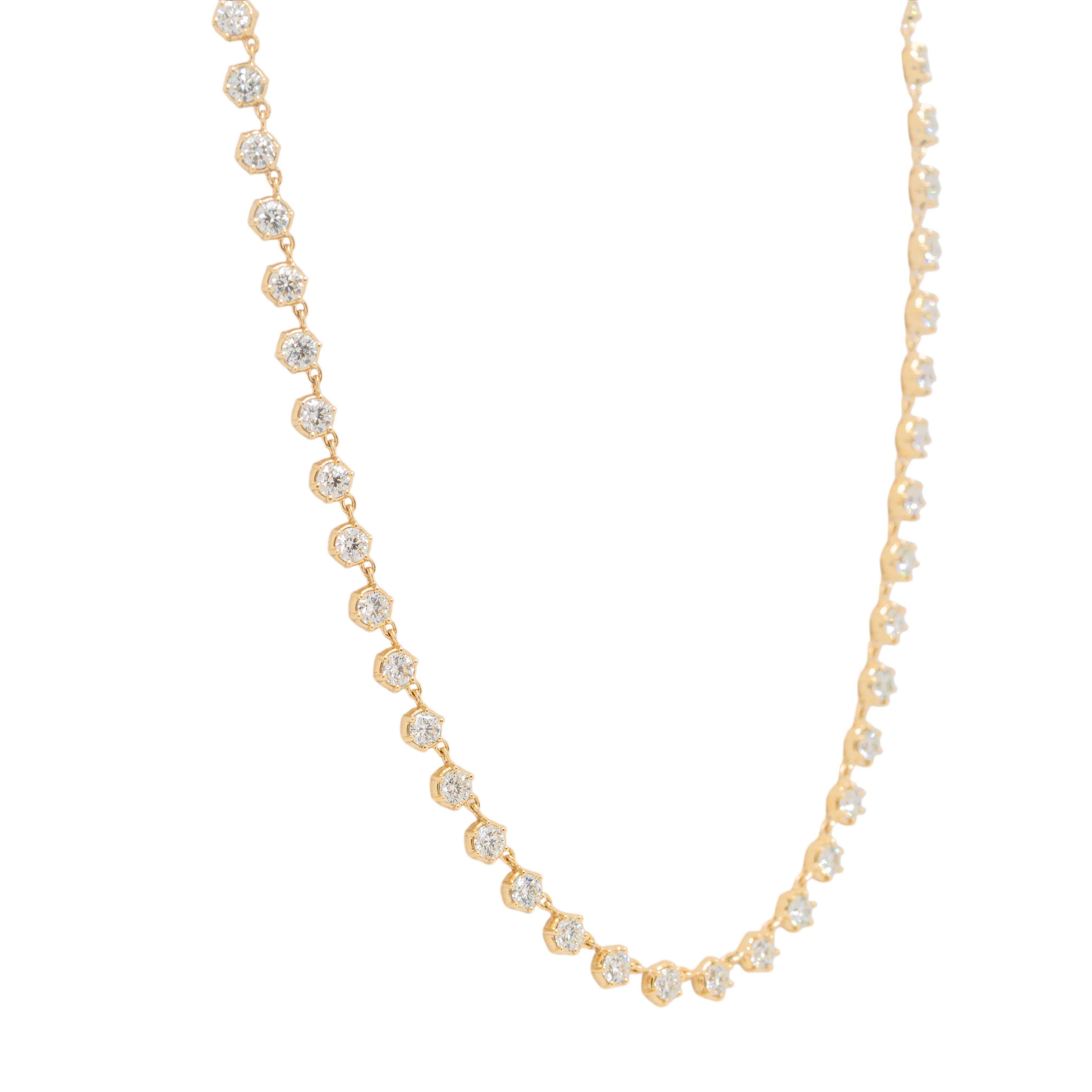 Diese atemberaubende Halskette aus 14-karätigem Gelbgold besticht durch ihr zeitloses Design mit runden, natürlichen Diamanten, die jeweils mit sechs Zacken sicher gefasst und durch elegante Kettenglieder verbunden sind, die einen fließenden und