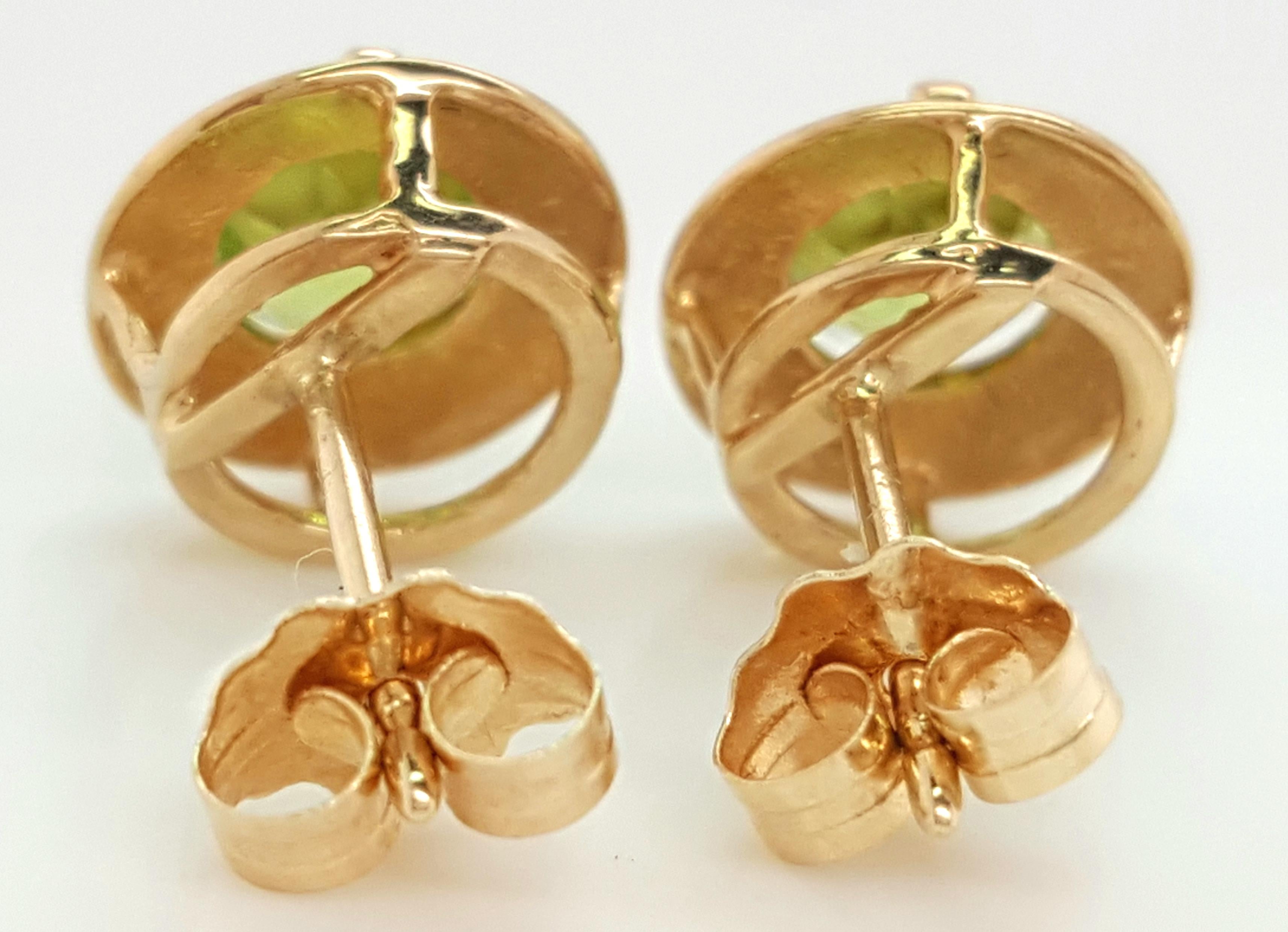 14 Karat Yellow Gold Round Peridot Stud Earrings For Sale 2