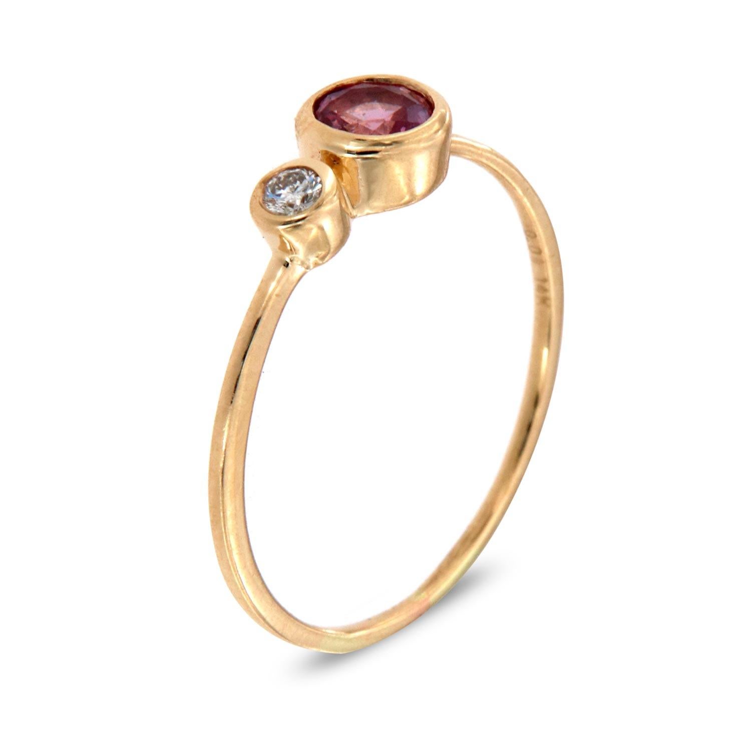 This petite fashion ring is impressive in its vintage appeal, featuring a bezeled natural pink round brilliant sapphire, accented with round brilliant diamond. Experience the difference in person!

Product details: 

Center Gemstone Type: