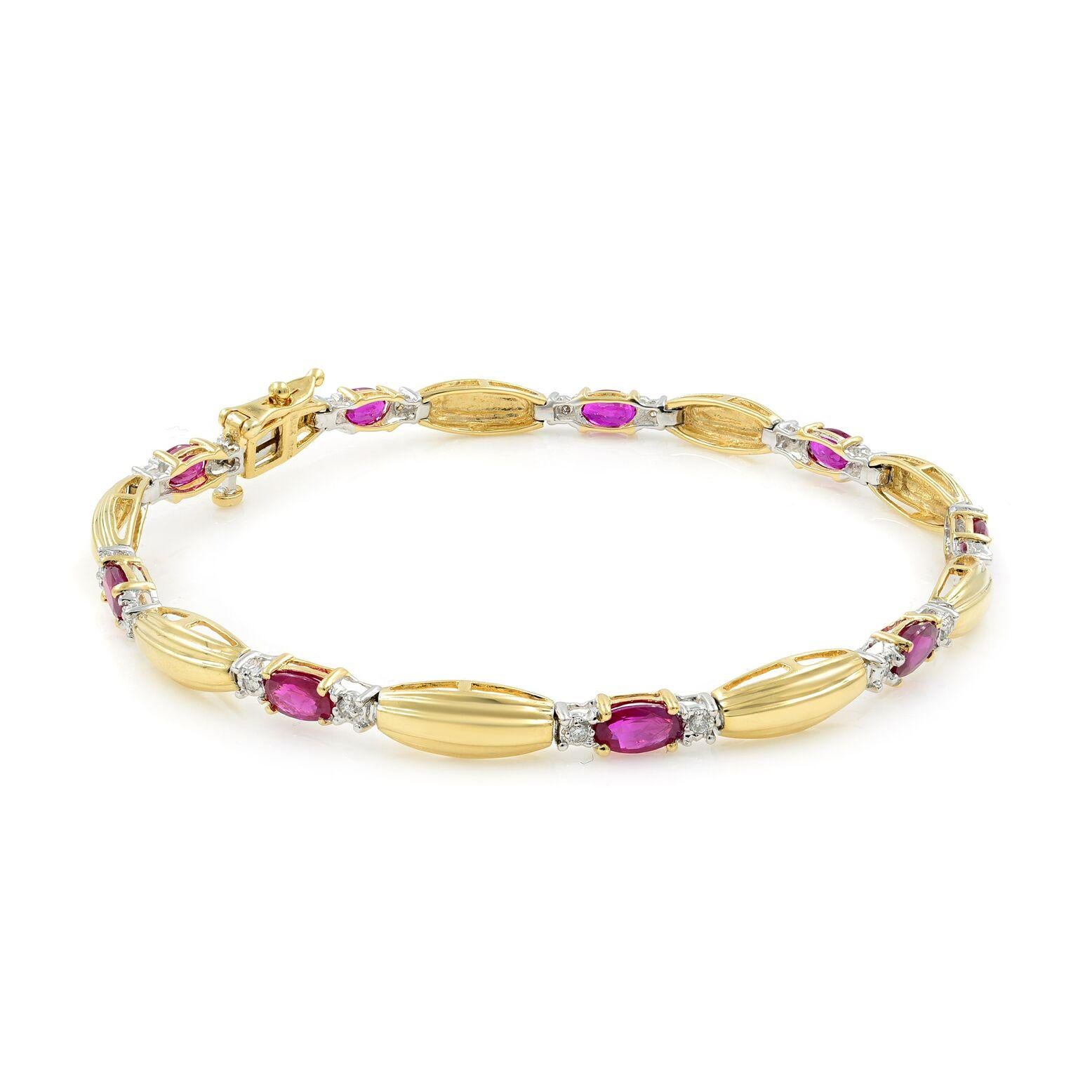 An elegantly tailored tennis bracelet in 14K yellow gold with alternating sections of nine oval cut rubies and 18 round cut diamonds. Measures 7 1/4 inches long by 3/7 inch wide.