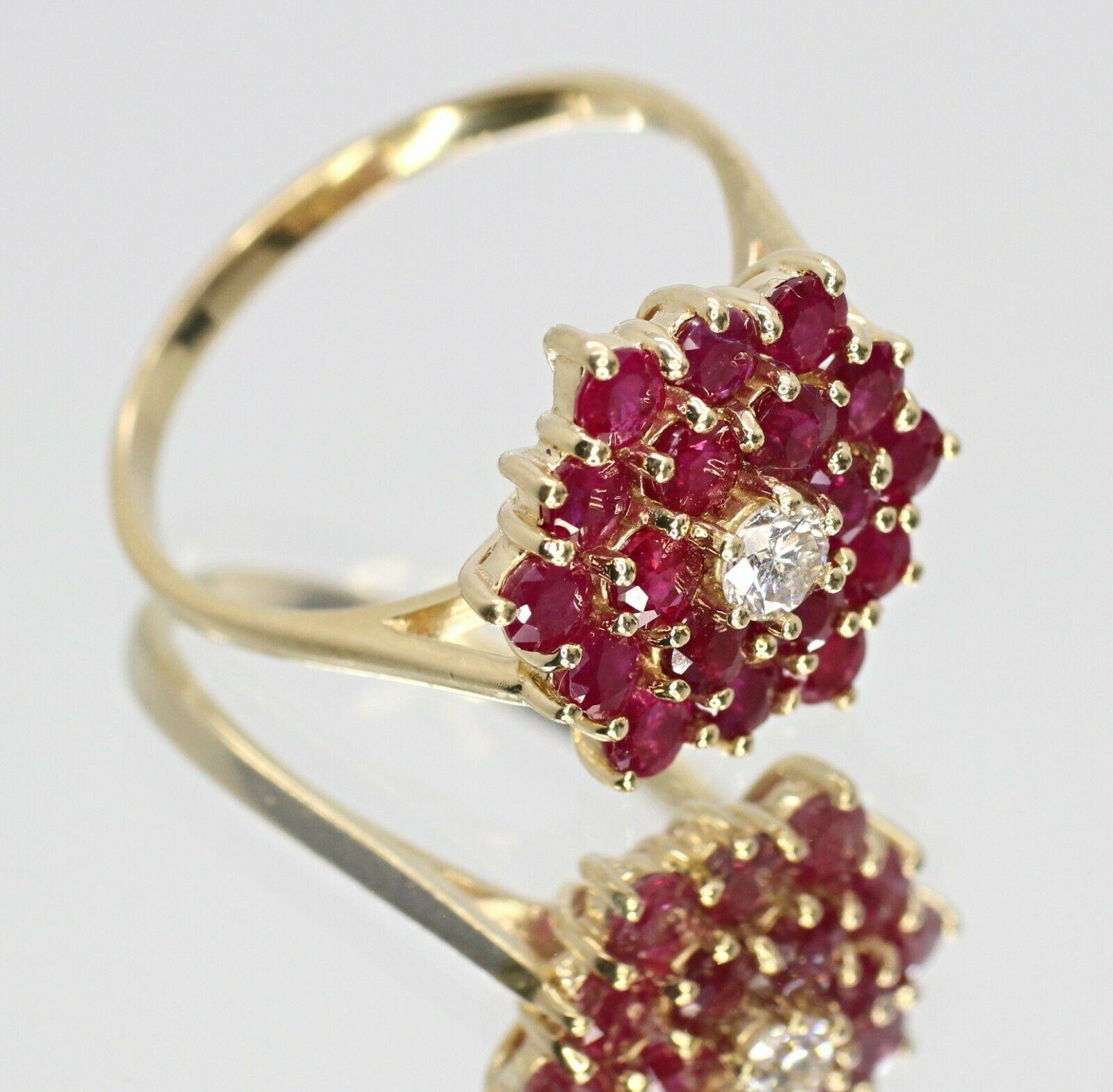 Beautiful vintage BH EFFY cluster ring. This ring features a one piece round cut diamond in approximately 0.15 carat, G color and Vs in stone clarity with 18 pcs round cut Ruby gemstone in 3.3mm. The current size of the ring is 10.25US.
